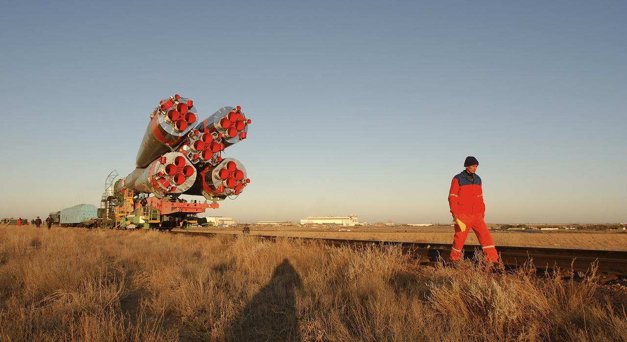 The Soyuz TMA-5 vehicle rolled to its launch pad at the Baikonur Cosmodrome in Kazakhstan, Tuesday, October 12, 2004, in preparation for its launch October 14 to send Expedition 10 Commander and NASA Science Officer Leroy Chiao, Flight Engineer and Soyuz Commander Salizhan Sharipov and Russian Space Forces cosmonaut Yuri Shargin to the International Space Station.  Chiao and Sharipov will replace the Expedition 9 crew of Gennady Padalka and Mike Fincke, while Shargin will conduct eight days of scientific experiments.  He will return to earth with the Expedition 9 crew October 24.  Photo Credit: (NASA/Bill Ingalls)