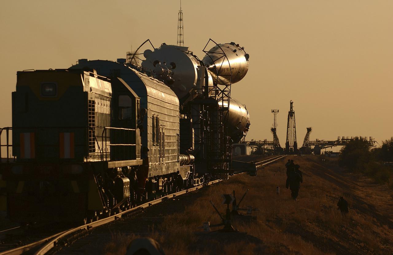 The Soyuz TMA-5 vehicle rolled to its launch pad at the Baikonur Cosmodrome in Kazakhstan, Tuesday, October 12, 2004, in preparation for its launch October 14 to send Expedition 10 Commander and NASA Science Officer Leroy Chiao, Flight Engineer and Soyuz Commander Salizhan Sharipov and Russian Space Forces cosmonaut Yuri Shargin to the International Space Station. Chiao and Sharipov will replace the Expedition 9 crew of Gennady Padalka and Mike Fincke, while Shargin will conduct eight days of scientific experiments. He will return to earth with the Expedition 9 crew October 24. Photo Credit: (NASA/Bill Ingalls)