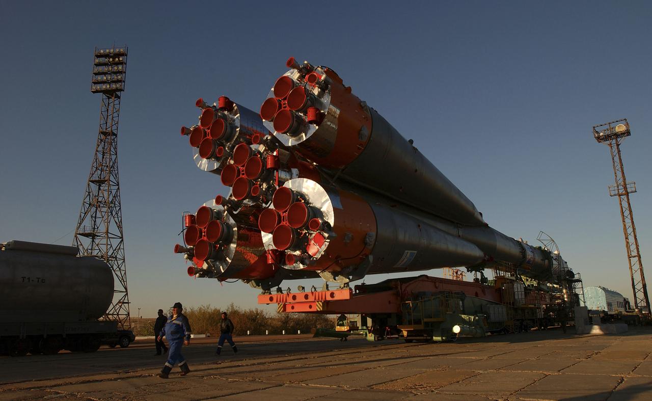 The Soyuz TMA-5 vehicle rolled to its launch pad at the Baikonur Cosmodrome in Kazakhstan, Tuesday, October 12, 2004, in preparation for its launch October 14 to send Expedition 10 Commander and NASA Science Officer Leroy Chiao, Flight Engineer and Soyuz Commander Salizhan Sharipov and Russian Space Forces cosmonaut Yuri Shargin to the International Space Station.  Chiao and Sharipov will replace the Expedition 9 crew of Gennady Padalka and Mike Fincke, while Shargin will conduct eight days of scientific experiments.  He will return to earth with the Expedition 9 crew October 24.  Photo Credit: (NASA/Bill Ingalls)