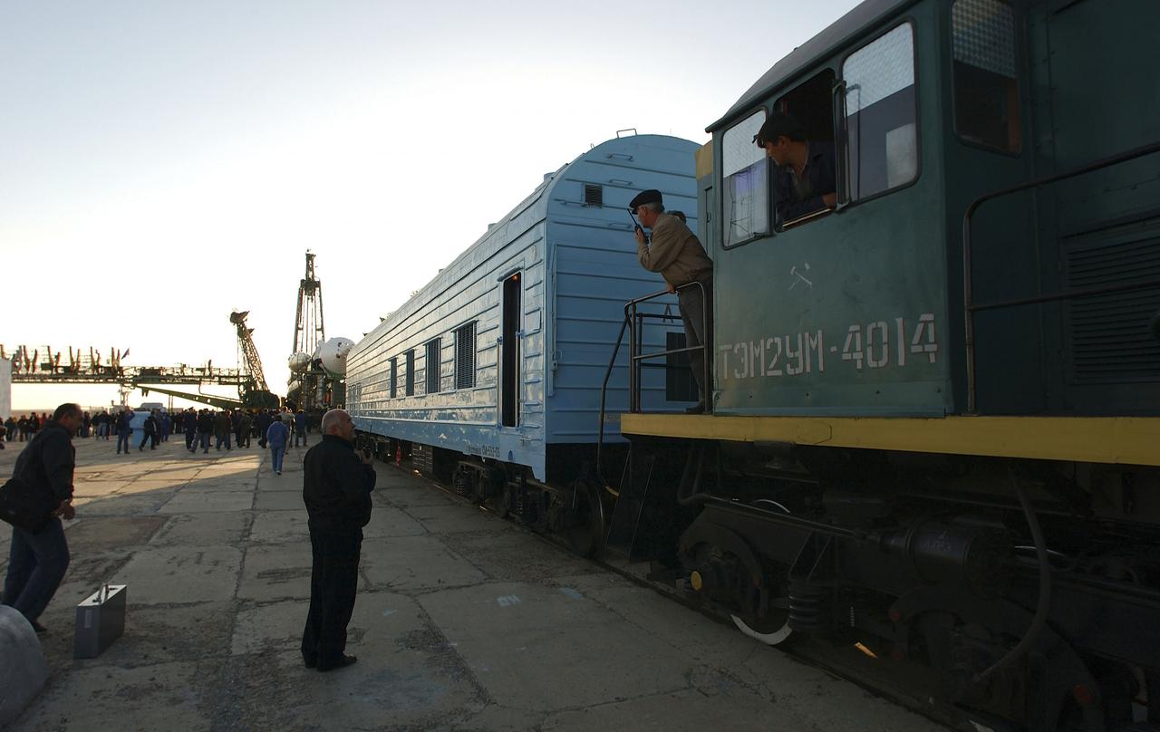 The Soyuz TMA-5 vehicle rolled to its launch pad at the Baikonur Cosmodrome in Kazakhstan, Tuesday, October 12, 2004, in preparation for its launch October 14 to send Expedition 10 Commander and NASA Science Officer Leroy Chiao, Flight Engineer and Soyuz Commander Salizhan Sharipov and Russian Space Forces cosmonaut Yuri Shargin to the International Space Station. Chiao and Sharipov will replace the Expedition 9 crew of Gennady Padalka and Mike Fincke, while Shargin will conduct eight days of scientific experiments. He will return to earth with the Expedition 9 crew October 24. Photo Credit: (NASA/Bill Ingalls)