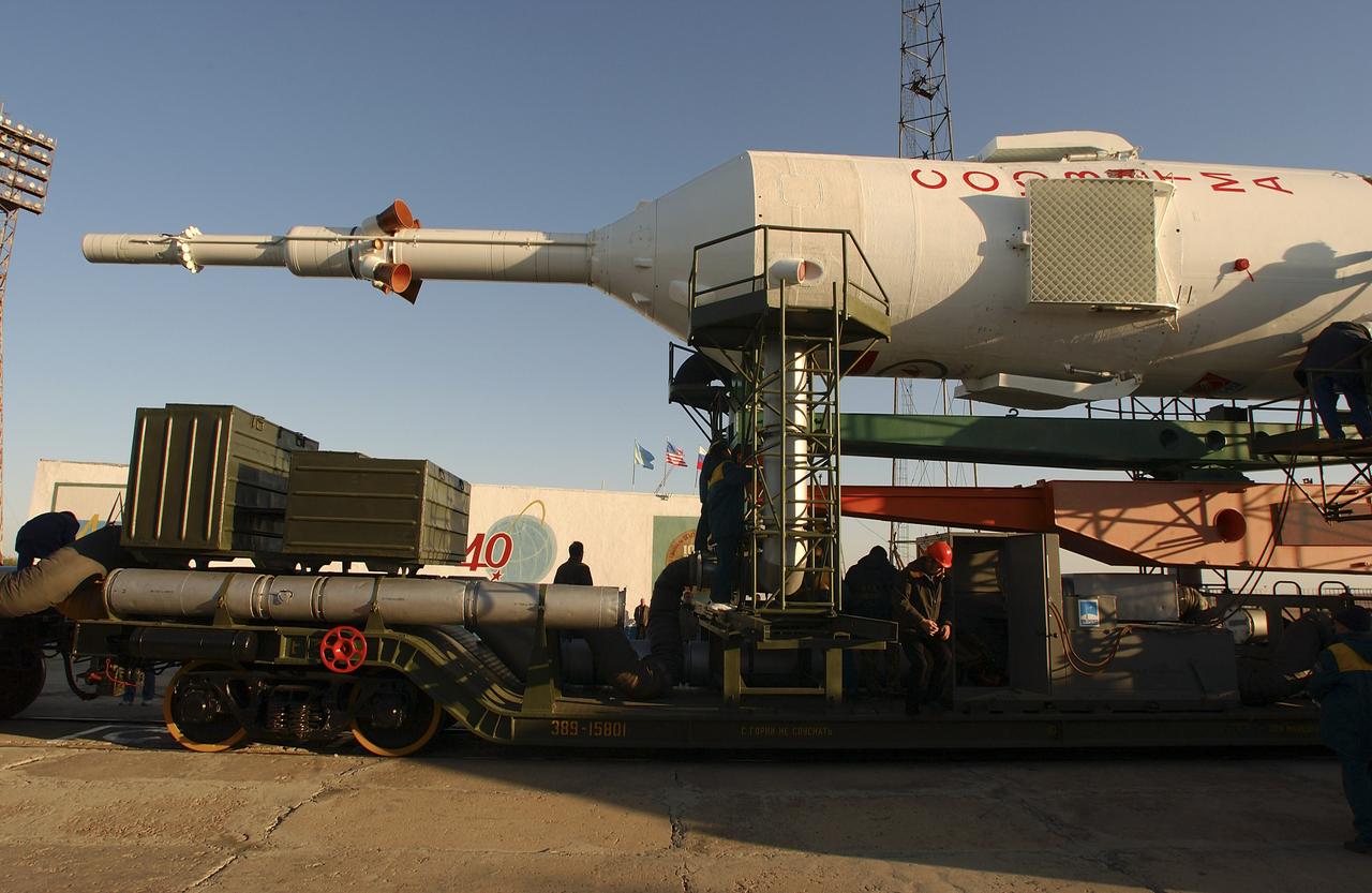 The Soyuz TMA-5 vehicle rolled to its launch pad at the Baikonur Cosmodrome in Kazakhstan, Tuesday, October 12, 2004, in preparation for its launch October 14 to send Expedition 10 Commander and NASA Science Officer Leroy Chiao, Flight Engineer and Soyuz Commander Salizhan Sharipov and Russian Space Forces cosmonaut Yuri Shargin to the International Space Station.  Chiao and Sharipov will replace the Expedition 9 crew of Gennady Padalka and Mike Fincke, while Shargin will conduct eight days of scientific experiments.  He will return to earth with the Expedition 9 crew October 24.  Photo Credit: (NASA/Bill Ingalls)