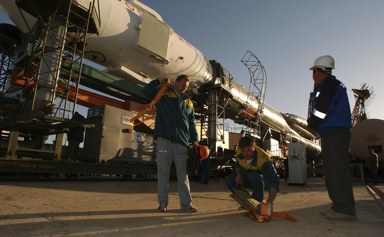 The Soyuz TMA-5 vehicle rolled to its launch pad at the Baikonur Cosmodrome in Kazakhstan, Tuesday, October 12, 2004, in preparation for its launch October 14 to send Expedition 10 Commander and NASA Science Officer Leroy Chiao, Flight Engineer and Soyuz Commander Salizhan Sharipov and Russian Space Forces cosmonaut Yuri Shargin to the International Space Station. Chiao and Sharipov will replace the Expedition 9 crew of Gennady Padalka and Mike Fincke, while Shargin will conduct eight days of scientific experiments. He will return to earth with the Expedition 9 crew October 24. Photo Credit: (NASA/Bill Ingalls)