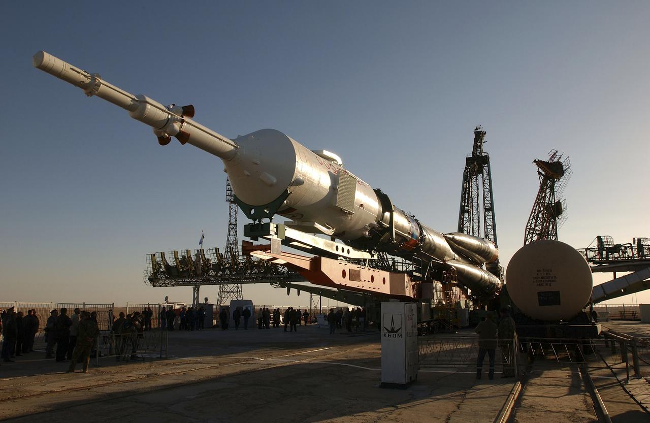 The Soyuz TMA-5 vehicle rolled to its launch pad at the Baikonur Cosmodrome in Kazakhstan, Tuesday, October 12, 2004, in preparation for its launch October 14 to send Expedition 10 Commander and NASA Science Officer Leroy Chiao, Flight Engineer and Soyuz Commander Salizhan Sharipov and Russian Space Forces cosmonaut Yuri Shargin to the International Space Station. Chiao and Sharipov will replace the Expedition 9 crew of Gennady Padalka and Mike Fincke, while Shargin will conduct eight days of scientific experiments. He will return to earth with the Expedition 9 crew October 24. Photo Credit: (NASA/Bill Ingalls)