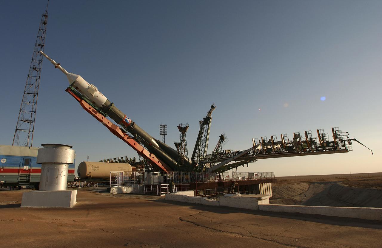The Soyuz TMA-5 vehicle rolled to its launch pad at the Baikonur Cosmodrome in Kazakhstan, Tuesday, October 12, 2004, in preparation for its launch October 14 to send Expedition 10 Commander and NASA Science Officer Leroy Chiao, Flight Engineer and Soyuz Commander Salizhan Sharipov and Russian Space Forces cosmonaut Yuri Shargin to the International Space Station. Chiao and Sharipov will replace the Expedition 9 crew of Gennady Padalka and Mike Fincke, while Shargin will conduct eight days of scientific experiments. He will return to earth with the Expedition 9 crew October 24. Photo Credit: (NASA/Bill Ingalls)