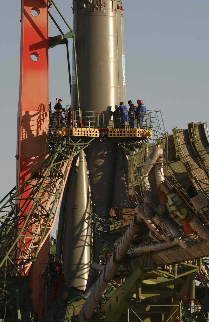 The Soyuz TMA-5 vehicle rolled to its launch pad at the Baikonur Cosmodrome in Kazakhstan, Tuesday, October 12, 2004, in preparation for its launch October 14 to send Expedition 10 Commander and NASA Science Officer Leroy Chiao, Flight Engineer and Soyuz Commander Salizhan Sharipov and Russian Space Forces cosmonaut Yuri Shargin to the International Space Station. Chiao and Sharipov will replace the Expedition 9 crew of Gennady Padalka and Mike Fincke, while Shargin will conduct eight days of scientific experiments. He will return to earth with the Expedition 9 crew October 24. Photo Credit: (NASA/Bill Ingalls)