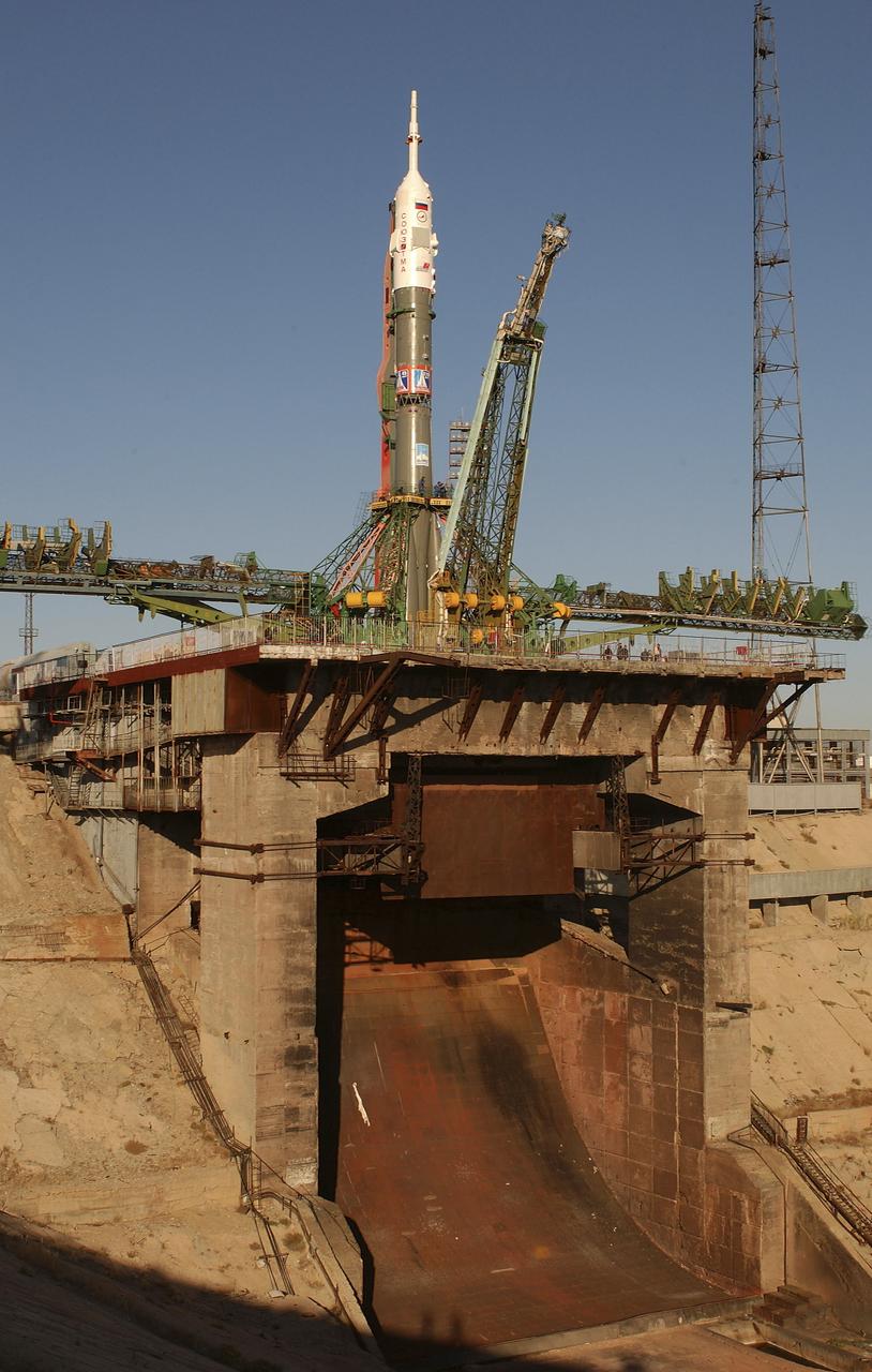The Soyuz TMA-5 vehicle rolled to its launch pad at the Baikonur Cosmodrome in Kazakhstan, Tuesday, October 12, 2004, in preparation for its launch October 14 to send Expedition 10 Commander and NASA Science Officer Leroy Chiao, Flight Engineer and Soyuz Commander Salizhan Sharipov and Russian Space Forces cosmonaut Yuri Shargin to the International Space Station. Chiao and Sharipov will replace the Expedition 9 crew of Gennady Padalka and Mike Fincke, while Shargin will conduct eight days of scientific experiments. He will return to earth with the Expedition 9 crew October 24. Photo Credit: (NASA/Bill Ingalls)