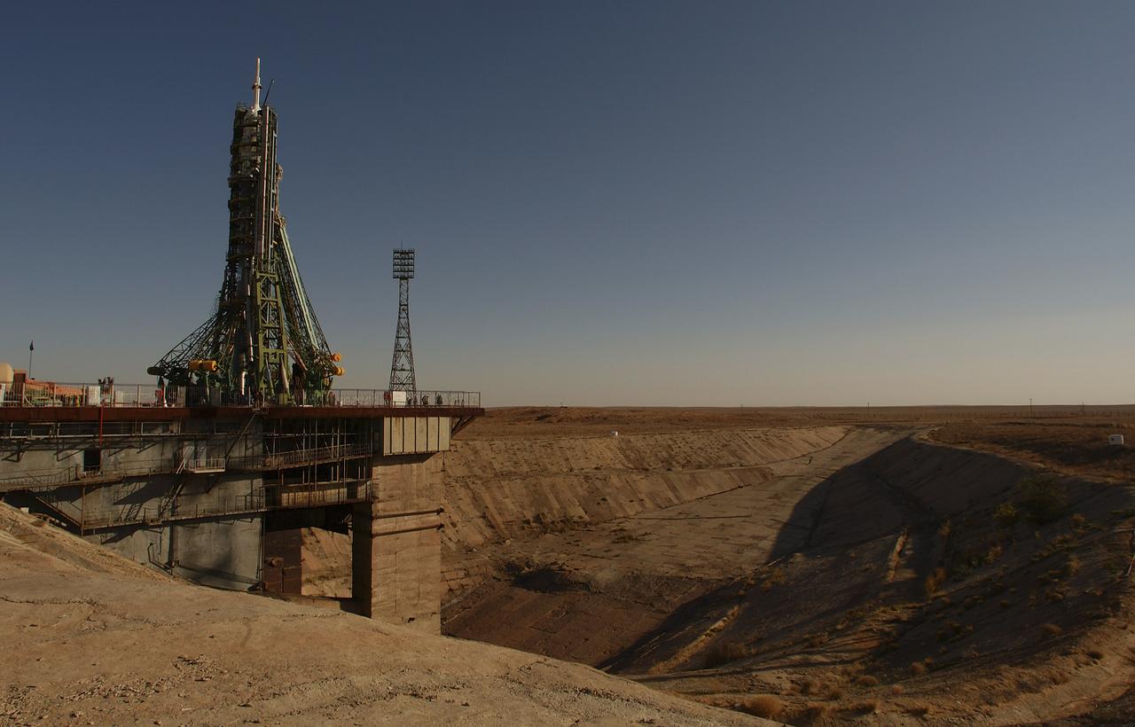The Soyuz TMA-5 vehicle rolled to its launch pad at the Baikonur Cosmodrome in Kazakhstan, Tuesday, October 12, 2004, in preparation for its launch October 14 to send Expedition 10 Commander and NASA Science Officer Leroy Chiao, Flight Engineer and Soyuz Commander Salizhan Sharipov and Russian Space Forces cosmonaut Yuri Shargin to the International Space Station. Chiao and Sharipov will replace the Expedition 9 crew of Gennady Padalka and Mike Fincke, while Shargin will conduct eight days of scientific experiments. He will return to earth with the Expedition 9 crew October 24. Photo Credit: (NASA/Bill Ingalls)