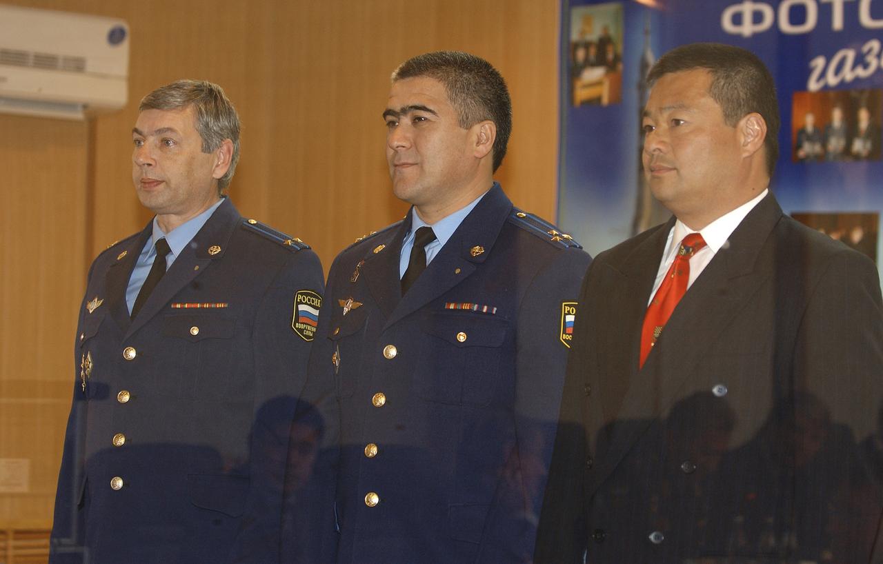 Expedition 10 Commander Leroy Chiao, right, Expedition 10 Soyuz Commander Salizhan Sharipov and Russian Space Forces cosmonaut Yuri Shargin, left, stand before the State Commission one day prior to their scheduled launch of the Soyuz TMA-5 spacecraft to the International Space Station, Wednesday, Oct. 13, 2004, in Baikonur, Kazakhstan. The crew docked to the Station on October 16, and Chiao and Sharipov will replace the current Station crewmembers, Gennady Padalka and Mike Fincke, who will return to Earth October 24 with Shargin.  Photo Credit: (NASA/Bill Ingalls)