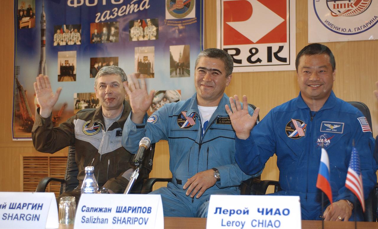 Russian Space Forces Cosmonaut Yuri Shargin, left, Expedition 10 Soyuz Commander Salizhan Sharipov, Expedition 10 Commander Leroy Chiao, right, talk to the press from behind glass one day prior to their scheduled launch of the Soyuz TMA-5 spacecraft to the International Space Station, Wednesday, Oct. 13, 2004, in Baikonur, Kazakhstan. The crew docked to the Station on October 16, and Chiao and Sharipov will replace the current Station crewmembers, Gennady Padalka and Mike Fincke, who will return to Earth October 24 with Shargin.  Photo Credit: (NASA/Bill Ingalls)