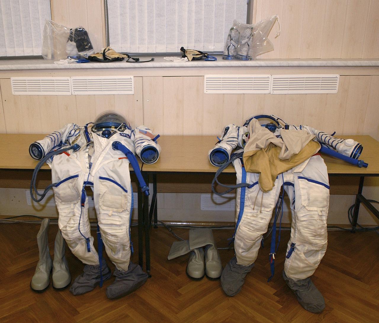 Russian spacesuits await the crew prior to launch, Thursday, Oct. 14, 2004, in Baikonur, Kazakhstan. The crew will dock to the International Space Station on October 16, and Chiao and Sharipov will replace the current station crewmembers, Gennady Padalka and Mike Fincke, who will return to Earth October 24 with Shargin. Photo Credit: (NASA/Bill Ingalls)