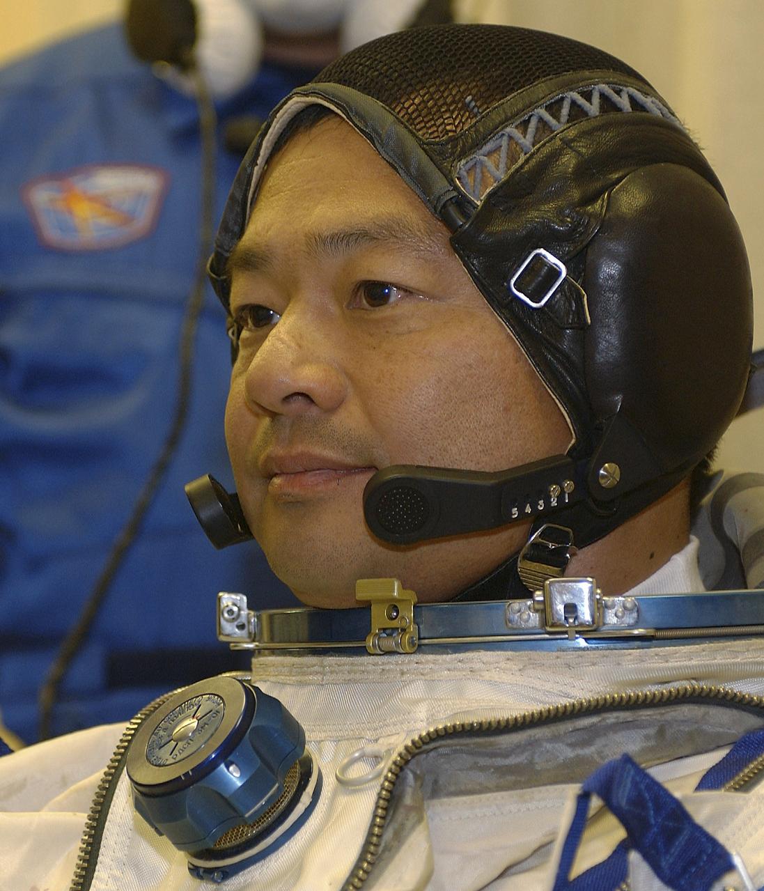 Expedition 10 Commander Leroy Chiao dons his flight suit prior to launch on board the Soyuz TMA-5 spacecraft to the International Space Station, Thursday, Oct. 14, in Baikonur, Kazakhstan.  The crew will dock to the Station on October 16, and Chiao and Sharipov will replace the current Station crew members, Gennady Padalka and Mike Fincke, who will return to Earth October 24 with Shargin.  Photo Credit: (NASA/Bill Ingalls)