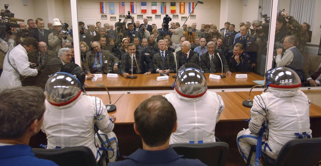 Expedition 10 Soyuz Commander Salizhan Sharipov, Expedition 10 Commander Leroy Chiao, Russian Space Forces cosmonaut Yuri Shargin and the backup crew talk to officials prior to their launch on board the Soyuz TMA-5 spacecraft to the International Space Station, Thursday, Oct. 14, in Baikonur, Kazakhstan.  The crew will dock to the Station on October 16, and Chiao and Sharipov will replace the current Station crew members, Gennady Padalka and Mike Fincke, who will return to Earth October 24 with Shargin.  Photo Credit: (NASA/Bill Ingalls)