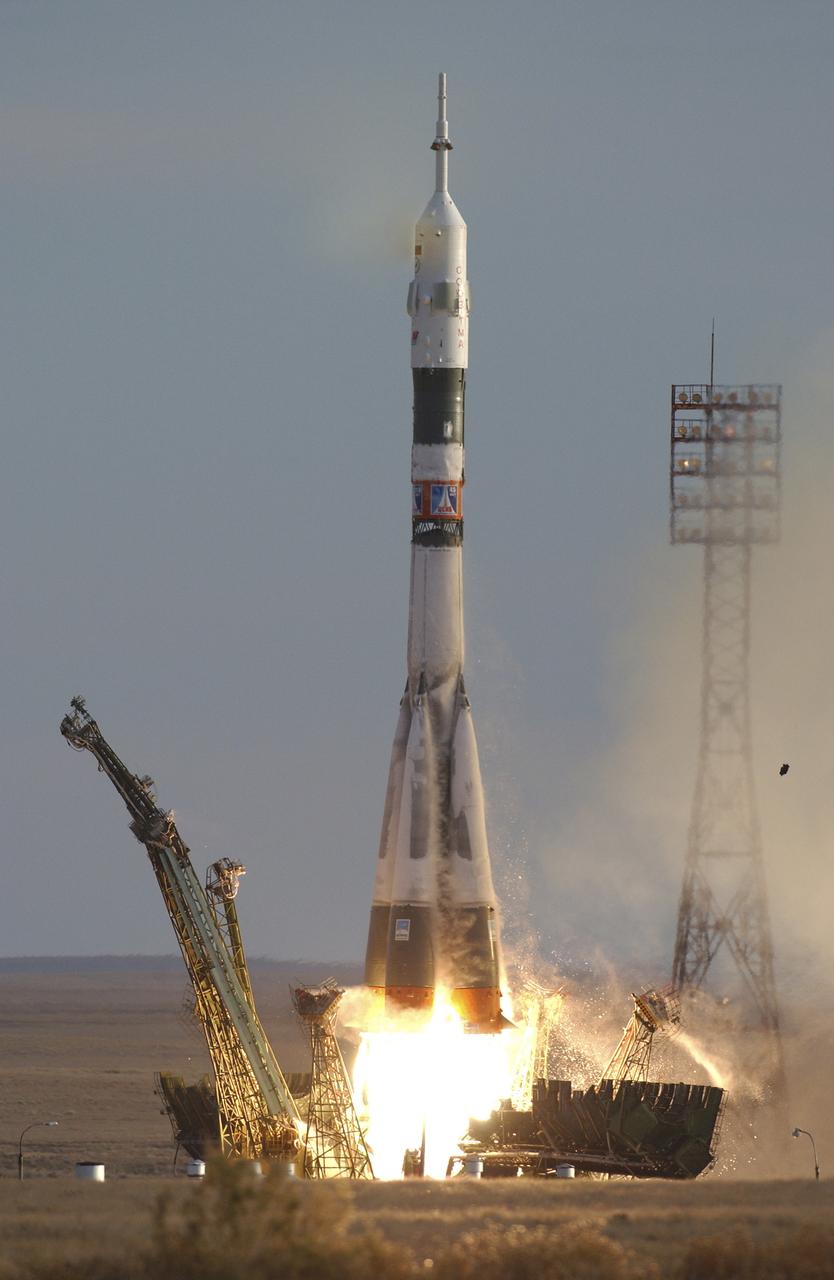 The Soyuz TMA-5 spacecraft blasts off from the Baikonur Cosmodrome in Kazakhstan, Thursday, October 14, 2004, carrying Expedition 10 Commander Leroy Chiao, Flight Engineer and Soyuz Commander Salizhan Sharipov and Russian Space Forces cosmonaut Yuri Shargin to the International Space Station.  The crew will dock to the Station on October 16, and Chiao and Sharipov will replace the current Station crew members, Gennady Padalka and Mike Fincke, who will return to Earth October 24 with Shargin.  Photo Credit: (NASA/Bill Ingalls)