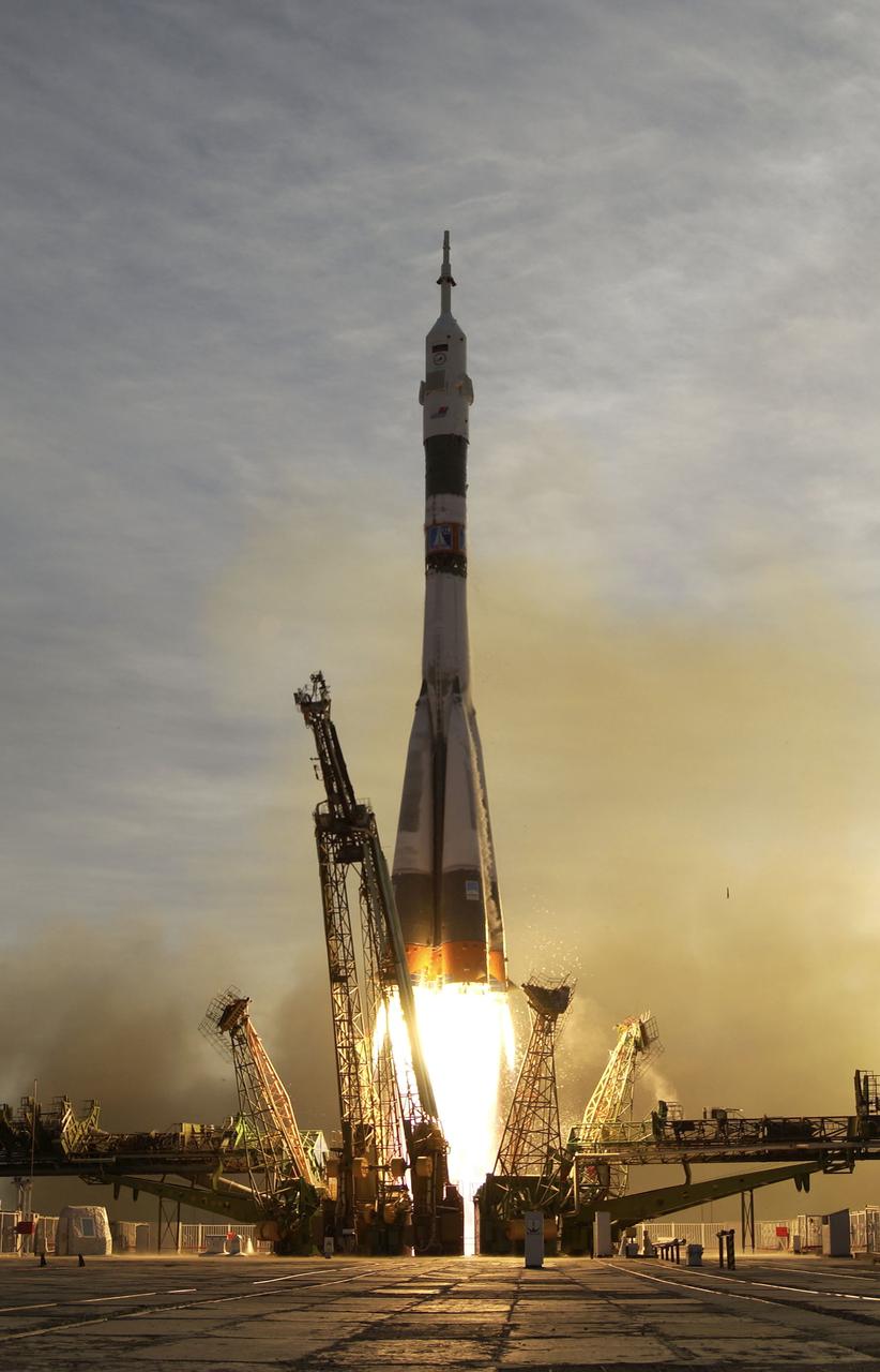 The Soyuz TMA-5 spacecraft blasts off from the Baikonur Cosmodrome in Kazakhstan, Thursday, October 14, 2004, carrying Expedition 10 Commander Leroy Chiao, Flight Engineer and Soyuz Commander Salizhan Sharipov and Russian Space Forces cosmonaut Yuri Shargin to the International Space Station.  The crew will dock to the Station on October 16, and Chiao and Sharipov will replace the current Station crew members, Gennady Padalka and Mike Fincke, who will return to Earth October 24 with Shargin.  Photo Credit: (NASA/Bill Ingalls)