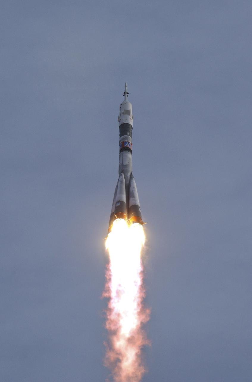The Soyuz TMA-5 spacecraft blasts off from the Baikonur Cosmodrome in Kazakhstan, Thursday, October 14, 2004, carrying Expedition 10 Commander Leroy Chiao, Flight Engineer and Soyuz Commander Salizhan Sharipov and Russian Space Forces cosmonaut Yuri Shargin to the International Space Station.  The crew will dock to the Station on October 16, and Chiao and Sharipov will replace the current Station crew members, Gennady Padalka and Mike Fincke, who will return to Earth October 24 with Shargin.  Photo Credit: (NASA/Bill Ingalls)