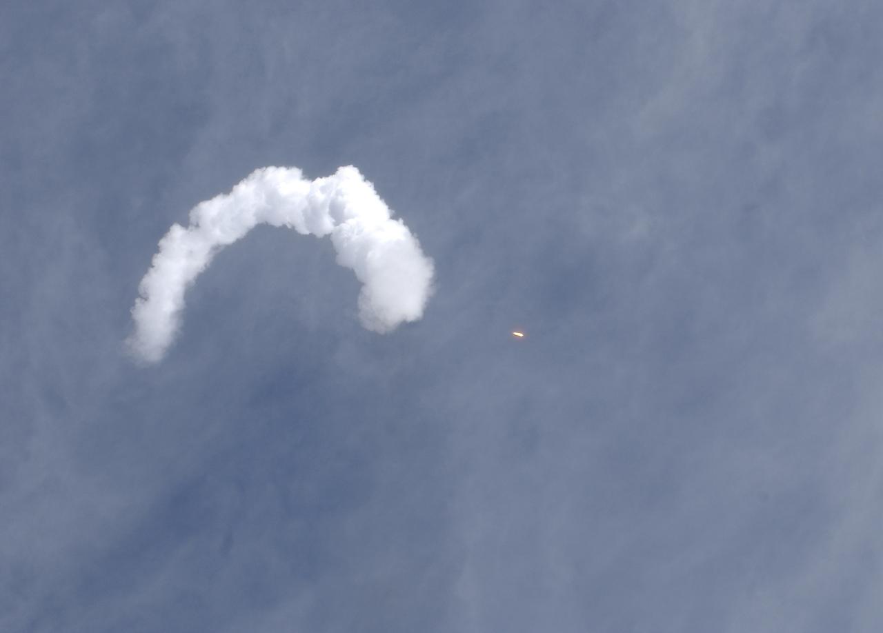 The Soyuz TMA-5 spacecraft blasts off from the Baikonur Cosmodrome in Kazakhstan, Thursday, October 14, 2004, carrying Expedition 10 Commander Leroy Chiao, Flight Engineer and Soyuz Commander Salizhan Sharipov and Russian Space Forces cosmonaut Yuri Shargin to the International Space Station.  The crew will dock to the Station on October 16, and Chiao and Sharipov will replace the current Station crew members, Gennady Padalka and Mike Fincke, who will return to Earth October 24 with Shargin.  Photo Credit: (NASA/Bill Ingalls)