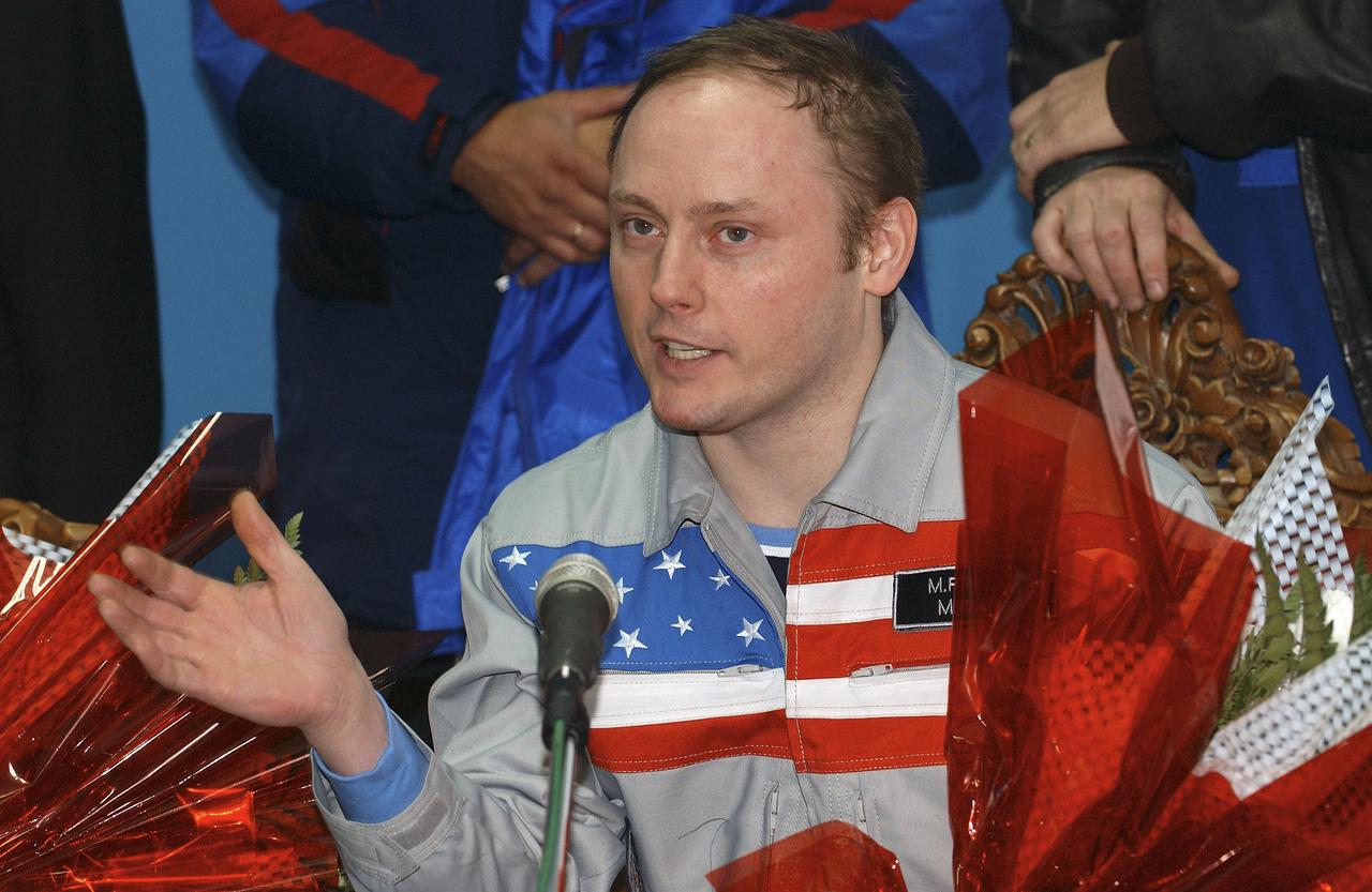 Expedition 9 Flight Engineer Michael Fincke talks during a press conference at the Kustanay, Kazakhstan airport after landing in the Soyuz capsule with Expedition 9 Commander Gennady Padalka and Russian Space Forces cosmonaut Yuri Shargin approximately 85 kilometers northeast of Arkalyk in northern Kazakhstan, Sunday, October 24, 2004. Photo Credit: (NASA/Bill Ingalls)