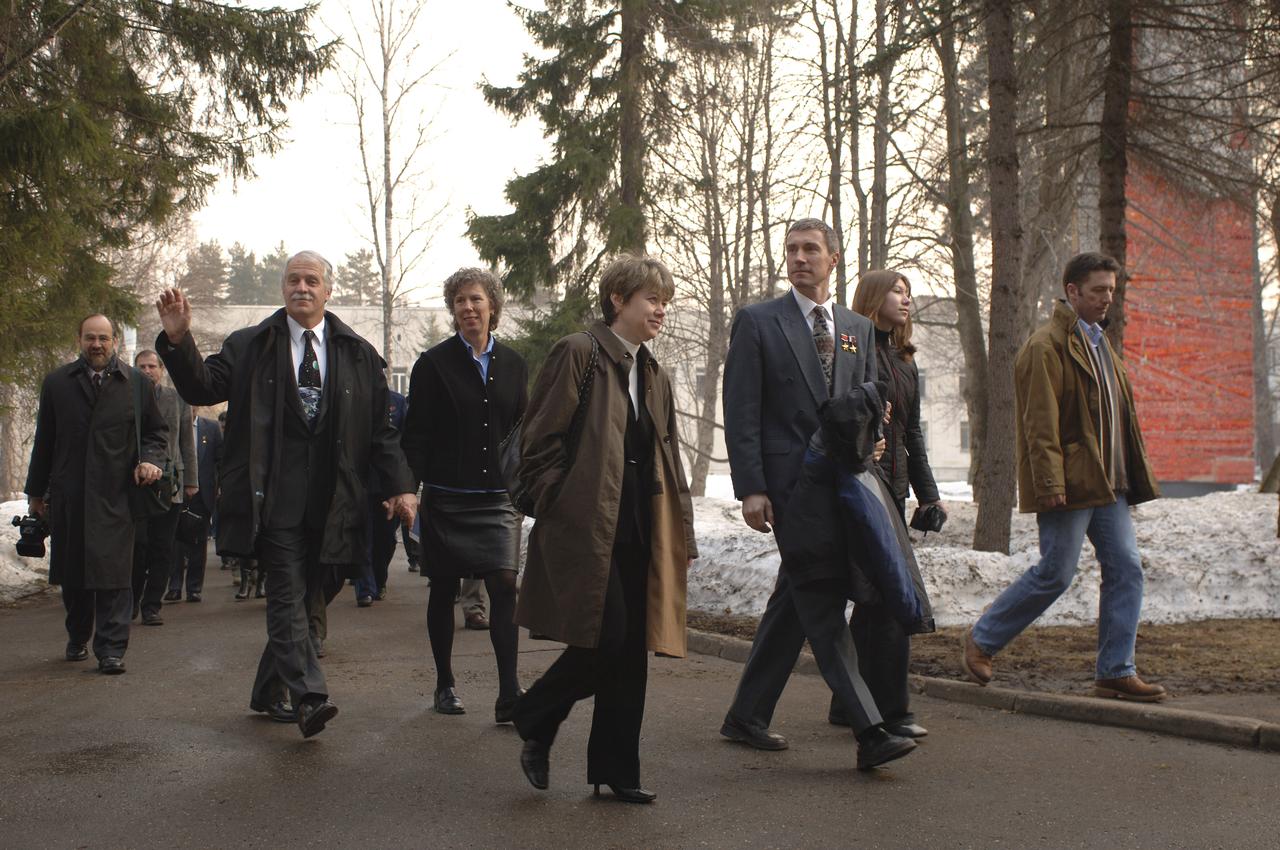 Expedition 11 Commander Sergei Krikalev, center, Flight Engineer John Phillips, left, and European Space Agency Astronaut Roberto Vittori of Italy, far right, depart the Gagarin Cosmonaut Training Center training base, Saturday, April 9, 2005, in Star City, Russia for travel to the Baikonur Cosmodrome in Kazakhstan for final pre-launch preparations. Krikalev, Phillips and Vittori will launch April 15 on a Soyuz TMA-6 spacecraft to the International Space Station. Krikalev and Phillips will spend six months in space and greet the first Shuttle crew to fly in more than two years when it arrives at the Station, while Vittori spends eight days on the Station under a commercial contract between ESA and the Russian Federal Space Agency. Photo Credit: (NASA/Bill Ingalls)