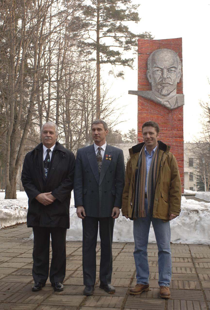 Expedition 11 Commander Sergei Krikalev, center, accompanied by Flight Engineer John Phillips, left, and European Space Agency Astronaut Roberto Vittori of Italy are seen at the Gagarin Cosmonaut Training Center training base, Saturday, April 9, 2005, in Star City, Russia, prior to their departure to the Baikonur Cosmodrome in Kazakhstan for final pre-launch preparations. Krikalev, Phillips and Vittori will launch April 15 on a Soyuz TMA-6 spacecraft to the International Space Station. Krikalev and Phillips will spend six months in space and greet the first Shuttle crew to fly in more than two years when it arrives at the Station, while Vittori spends eight days on the Station under a commercial contract between ESA and the Russian Federal Space Agency. Photo Credit: (NASA/Bill Ingalls)