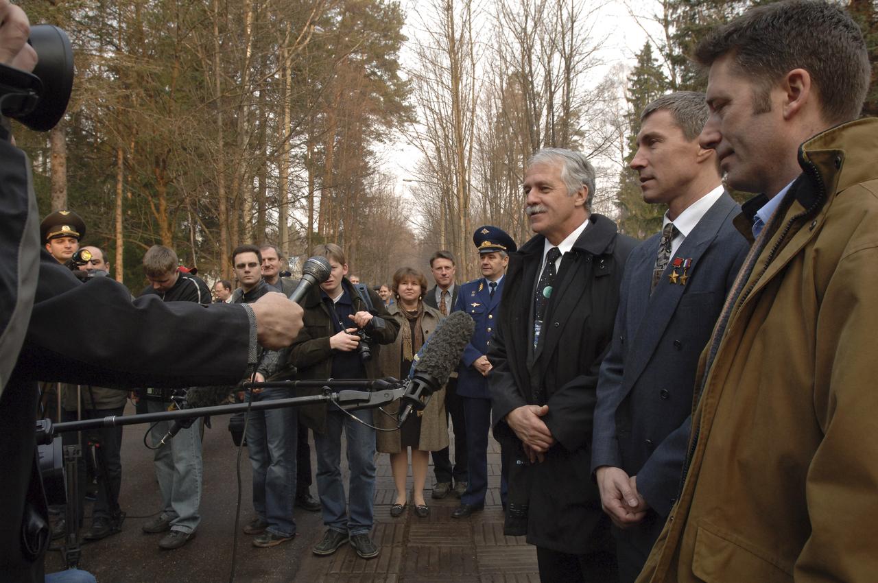 Expedition 11 Commander Sergei Krikalev, center, Flight Engineer John Phillips, left, and European Space Agency Astronaut Roberto Vittori, of Italy, answer questions from the media prior to their departure from the Gagarin Cosmonaut Training Center training base, Saturday, April 9, 2005, in Star City, Russia. The trio traveled to the Baikonur Cosmodrome in Kazakhstan for final pre-launch preparations. Krikalev, Phillips and Vittori will launch April 15 on a Soyuz TMA-6 spacecraft to the International Space Station. Krikalev and Phillips will spend six months in space and greet the first Shuttle crew to fly in more than two years when it arrives at the Station, while Vittori spends eight days on the Station under a commercial contract between ESA and the Russian Federal Space Agency. Photo Credit: (NASA/Bill Ingalls)
