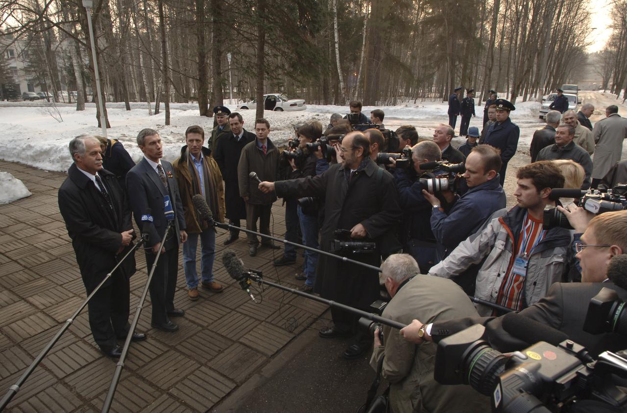 Expedition 11 Commander Sergei Krikalev, center, Flight Engineer John Phillips, left, and European Space Agency Astronaut Roberto Vittori, of Italy, answer questions from the media prior to their departure from the Gagarin Cosmonaut Training Center training base, Saturday, April 9, 2005, in Star City, Russia. The trio traveled to the Baikonur Cosmodrome in Kazakhstan for final pre-launch preparations. Krikalev, Phillips and Vittori will launch April 15 on a Soyuz TMA-6 spacecraft to the International Space Station. Krikalev and Phillips will spend six months in space and greet the first Shuttle crew to fly in more than two years when it arrives at the Station, while Vittori spends eight days on the Station under a commercial contract between ESA and the Russian Federal Space Agency. Photo Credit: (NASA/Bill Ingalls)