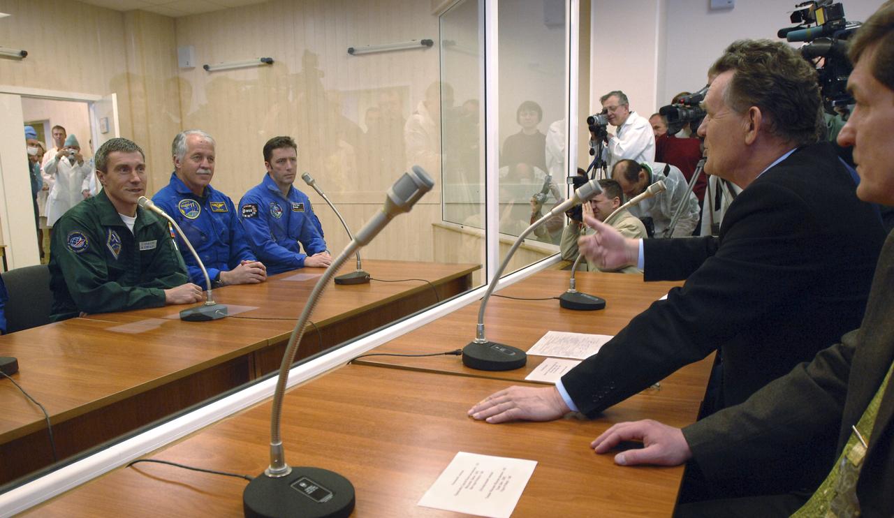 Expedition 11 Commander Sergei Krikalev, left, Flight Engineer John Phillips and European Space Agency astronaut Roberto Vittori, right, discuss the checkout of the Soyuz TMA-6 spacecraft with Russian space officials at the Baikonur Cosmodrome in Baikonur, Kazakhstan, Sunday, April 10, 2005, during preparations for their launch to the International Space Station. Krikalev, Phillips and Vittori will launch April 15 on a Soyuz TMA-6 spacecraft to the International Space Station. Krikalev and Phillips will spend six months in space and greet the first Shuttle crew to fly in more than two years when it arrives at the station, while Vittori spends eight days on the station under a commercial contract between ESA and the Russian Federal Space Agency.  Photo Credit: (NASA/Bill Ingalls)