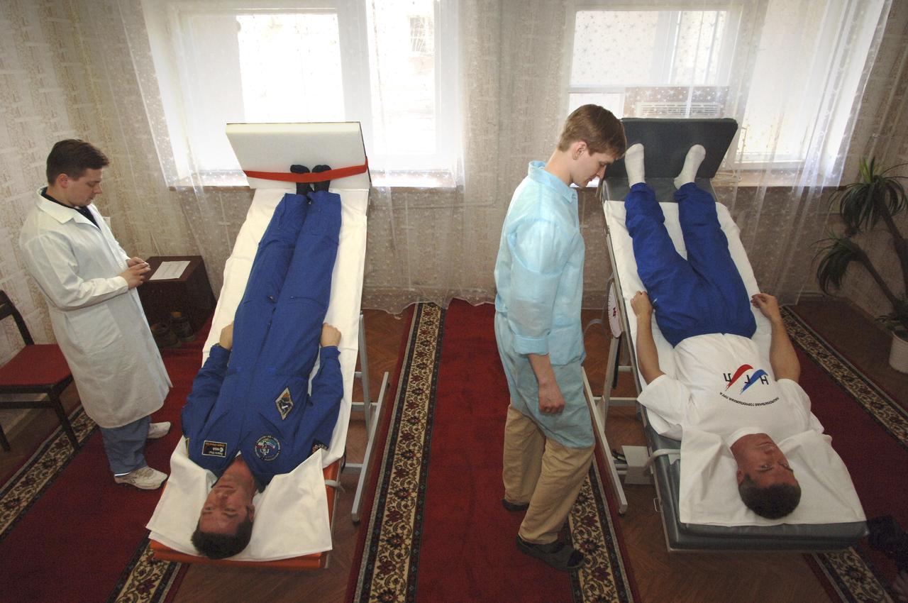 European Space Agency astronaut Roberto Vittori, of Italy, left, and Expedition 11 Commander Sergei Krikalev participate in tilt table tests, Sunday, April 10, 2005, so technicians can collect pre-launch data on the state of their equilibrium prior to the April 15 launch to the International Space Station with Flight Engineer John Phillips in Baikonur, Kazakhstan. Photo Credit: (NASA/Bill Ingalls)