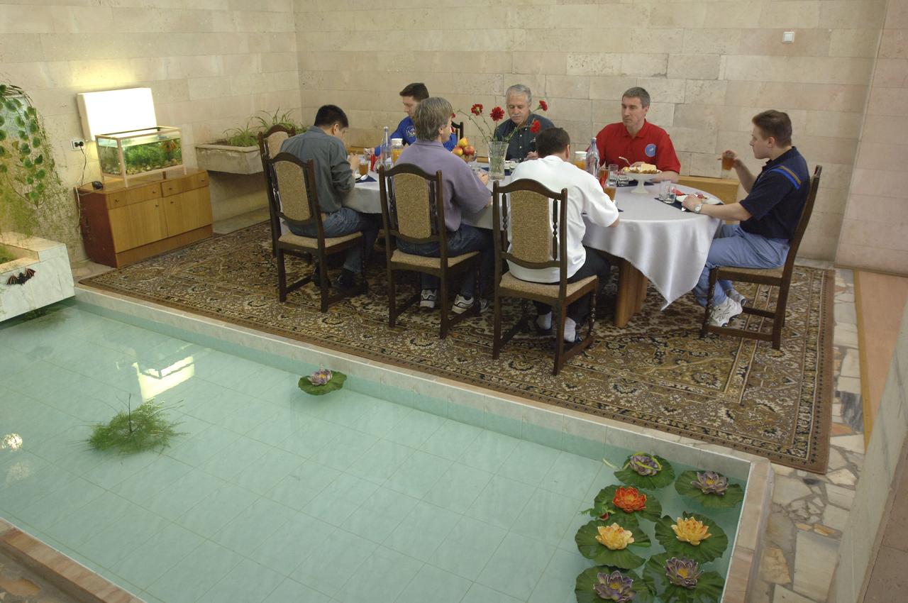 The Expedition 11 crew and their backup crew enjoy lunch at the Cosmonaut hotel, Monday, April 11, 2005, in Baikonur, Kazakhstan several days prior to the April 15 launch to the International Space Station from the Baikonur Cosmodrome in Kazakhstan. Photo Credit: (NASA/Bill Ingalls)