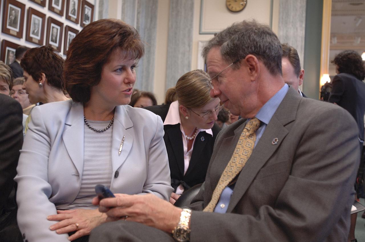 Dr. Michael Griffin, right, talks with his wife Rebecca Griffin prior to testifying at his confirmation hearing before the U.S. Senate Commerce Committee, Tuesday, April 12, 2005, at the Russell Senate Office Building in Washington. If confirmed, Griffin, who currently heads the space department at the Johns Hopkins University Applied Physics Laboratory will become NASA's 11th administrator. Photo Credit (NASA/Renee Bouchard)