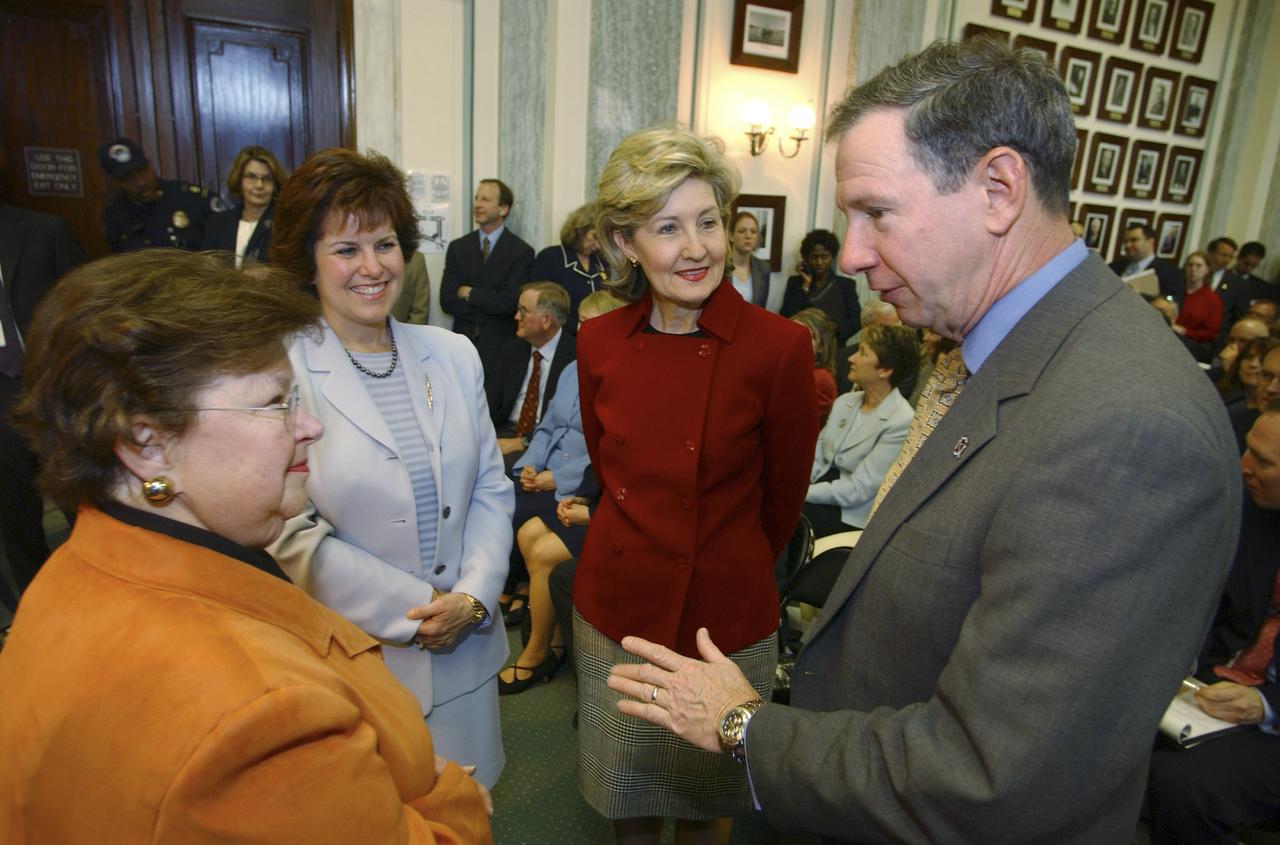 U.S. Senator Barbara Mikulski, D-Md., left, talks with Michael Griffin as Senator Kay Bailey Hutchison, R-Tx., and Griffin's wife Rebecca look on prior to his testimony, Tuesday, April 12, 2005, at the Russell Senate Office Building in Washington. If confirmed, Griffin, who currently heads the space department at the Johns Hopkins University Applied Physics Laboratory will become NASA's 11th administrator. Photo Credit: (NASA/Renee Bouchard)