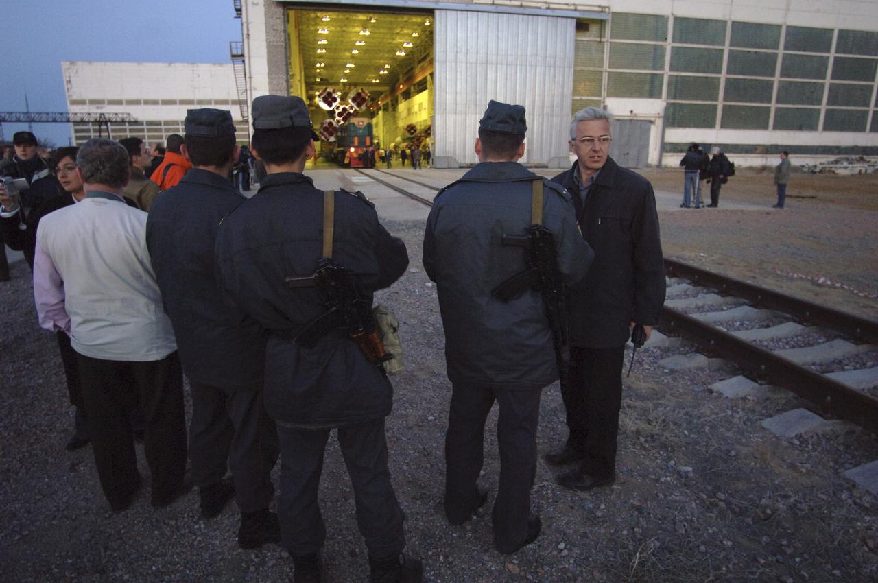 Officials wait for the Soyuz TMA-6 vehicle to be rolled to its launch pad at the Baikonur Cosmodrome in Kazakhstan, Wednesday, April 13, 2005 in preparation for the April 15 launch to send Expedition 11 Commander Sergei Krikalev, Flight Engineer John Phillips and European Space Agency Astronaut Roberto Vittori, of Italy, to the International Space Station. Krikalev and Phillips will spend six months in space and greet the first Shuttle crew to fly in more than two years when it arrives at the station, while Vittori spends eight days on the station under a commercial contract between ESA and the Russian Federal Space Agency. Photo Credit: (NASA/Bill Ingalls)