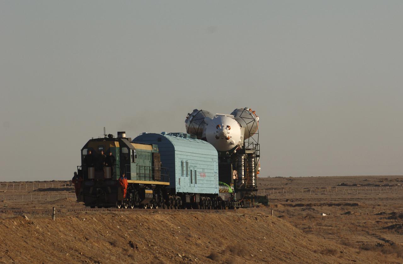 The Soyuz TMA-6 vehicle is transported by train to the launch pad at the Baikonur Cosmodrome in Kazakhstan, Wednesday, April 13, 2005, as preparations continued for the April 15 launch to send Expedition 11 Commander Sergei Krikalev, Flight Engineer John Phillips and European Space Agency Astronaut Roberto Vittori, of Italy, to the International Space Station. Krikalev and Phillips will spend six months in space and greet the first Shuttle crew to fly in more than two years when it arrives at the station, while Vittori spends eight days on the station under a commercial contract between ESA and the Russian Federal Space Agency. Photo Credit: (NASA/Bill Ingalls)