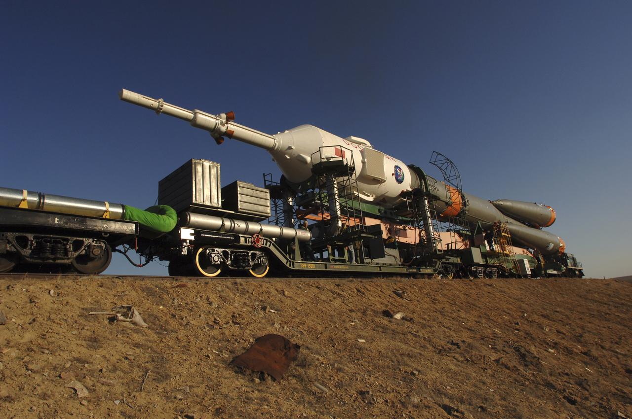 The Soyuz TMA-6 vehicle is transported by train to the launch pad at the Baikonur Cosmodrome in Kazakhstan, Wednesday, April 13, 2005, as preparations continued for the April 15 launch to send Expedition 11 Commander Sergei Krikalev, Flight Engineer John Phillips and European Space Agency Astronaut Roberto Vittori, of Italy, to the International Space Station. Krikalev and Phillips will spend six months in space and greet the first Shuttle crew to fly in more than two years when it arrives at the station, while Vittori spends eight days on the station under a commercial contract between ESA and the Russian Federal Space Agency. Photo Credit: (NASA/Bill Ingalls)