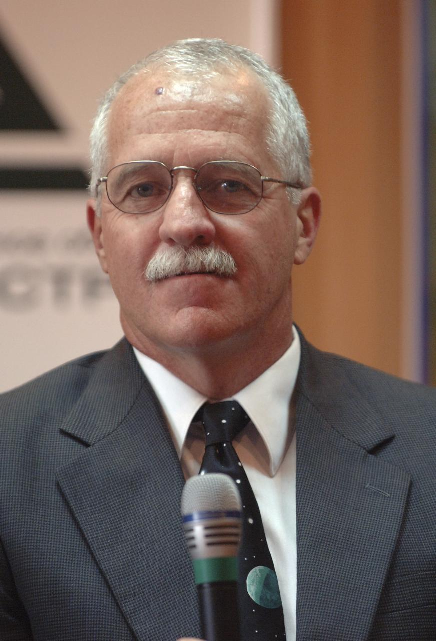 Expedition 11 Flight Engineer and NASA Science Officer John Phillips is seen during a press conference, Thursday, April 14, 2005, in Baikonur, Kazakhstan. Phillips, Expedition 11 Commander Sergei Krikalev and, European Space Agency astronaut Roberto Vittori, of Italy, are scheduled to launch aboard a Soyuz TMA-6 spacecraft April 15. Krikalev and Phillips will spend six months on the station, replacing Expedition 10 Commander Leroy Chiao and Flight Engineer Salizhan Sharipov, while Vittori will spend eight days on the station under a commerical contract between ESA and the Russian Federal Space Agency, returning to Earth with Chiao and Sharipov on April 25. Photo Credit: (NASA/Bill Ingalls)