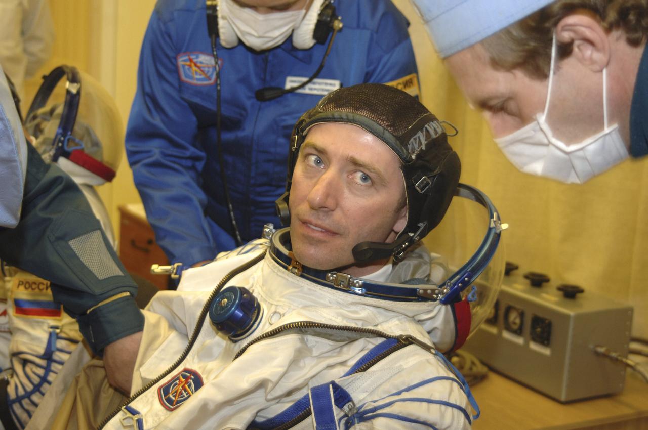 European Space Agency astronaut Roberto Vittori, of Italy, is outfitted in his Russian Sokol suit, Friday, April 15, 2005, in Baikonur, Kazakhstan. Vittori, along with Expedition 11 Commander Sergei Krikalev and Flight Engineer and NASA Science Officer John Phillips were preparing for launch aboard the Soyuz TMA-6 spacecraft from the Baikonur Cosmodrome in Kazakhstan at daybreak on April 15 for a two-day trip to the International Space Station. Krikalev and Phillips will spend six months on the station, replacing Expedition 10 Commander Leroy Chiao and Flight Engineer Salizhan Sharipov, while Vittori will spend eight days on the Station under a commerical contract between ESA and the Russian Federal Space Agency, returning to Earth with Chiao and Sharipov on April 25. Photo Credit: (NASA/Bill Ingalls)