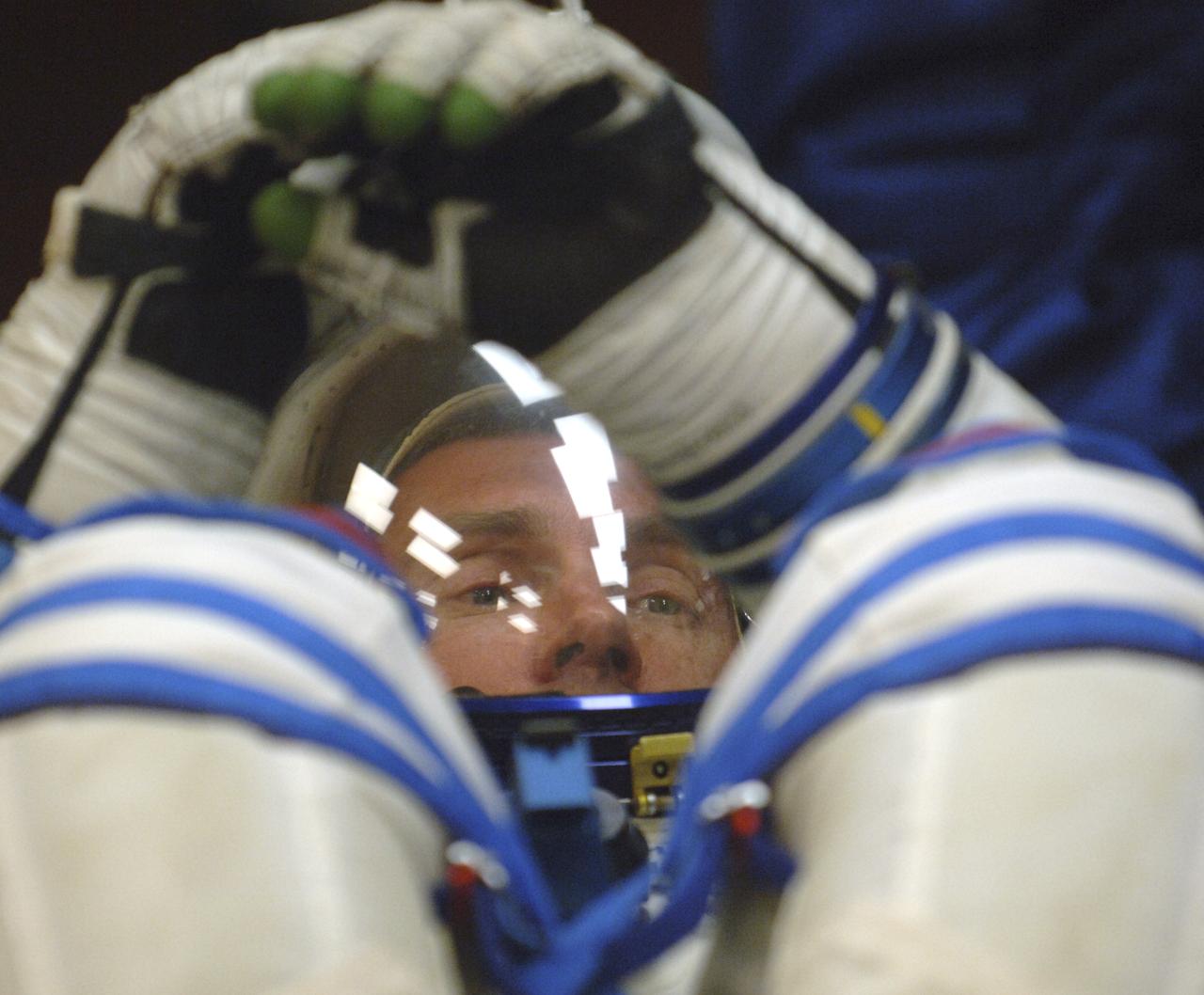Expedition 11 Commander Sergei Krikalev checks his gear prior to launch aboard the Soyuz TMA-6 spacecraft from the Baikonur Cosmodrome in Kazakhstan, Friday, April 15, 2005, for a two-day trip to the International Space Station. Photo Credit: (NASA/Bill Ingalls)