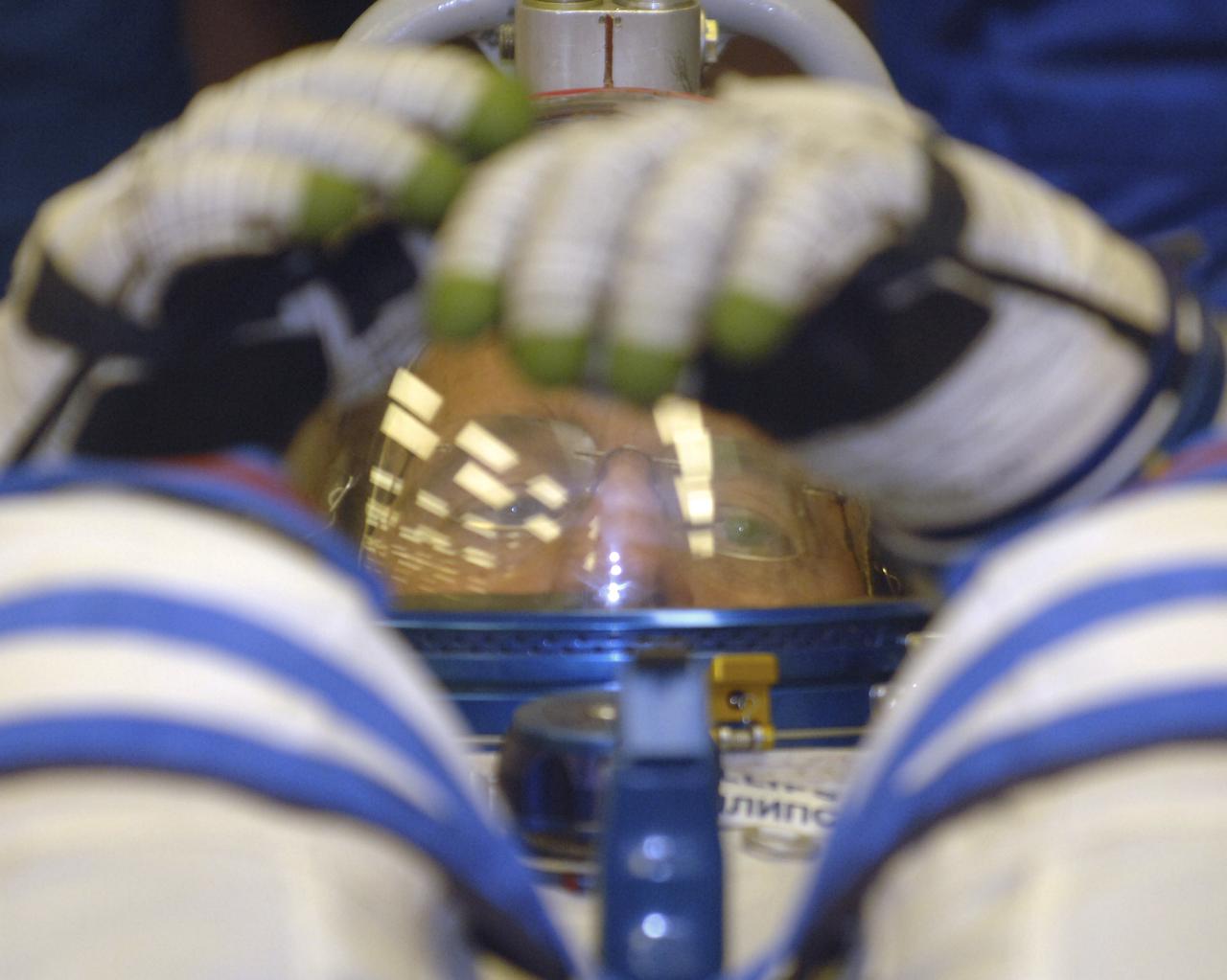Expedition 11 Flight Engineer and NASA Science Officer John Phillips checks his gear prior to launch aboard the Soyuz TMA-6 spacecraft at the Baikonur Cosmodrome in Baikonur, Kazakhstan, Friday, April 15, 2005, for a two-day trip to the International Space Station. Photo Credit: (NASA/Bill Ingalls)