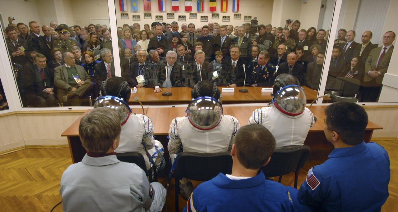 Expedition 11 Commander Sergei Krikalev, Flight Engineer and NASA Science Officer John Phillips and European Space Agency Astronaut Roberto Vittori, of Italy, talk to Anatoly Perminov, Head of the Russian Federal Space Agency (ROSCOSMOS) prior to launch aboard the Soyuz TMA-6 spacecraft from the Baikonur Cosmodrome in Kazakhstan, Friday, April 15, 2005. Krikalev and Phillips will spend six months on the Station, replacing Expedition 10 Commander Leroy Chiao and Flight Engineer Salizhan Sharipov, while Vittori will spend eight days on the Station under a commercial contract between ESA and the Russian Federal Space Agency, returning to Earth with Chiao and Sharipov on April 25. Photo Credit: (NASA/Bill Ingalls)