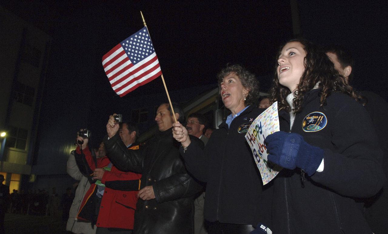 Unidentified family members of NASA astronaut John Phillips waves offers up best wishes for a safe mission and a happy birthday prior to launch, Friday, April 15, 2005, aboard the Soyuz TMA-6 spacecraft from the Baikonur Cosmodrome in Kazakhstan for a two-day trip to the International Space Station where he will spend six months living in space. Photo Credit: (NASA/Bill Ingalls)