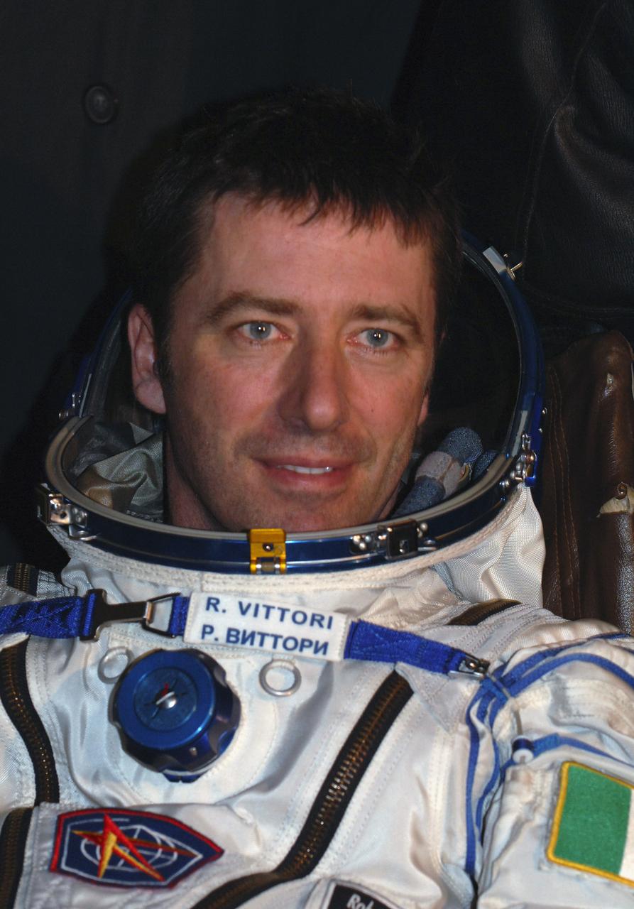 European Space Agency astronaut Roberto Vittori takes questions from the press after a pre-dawn landing in the Soyuz TMA-5 capsule Monday, April 25, 2005 northeast of the town of Arkalyk, Kazakhstan.  Expedition 10 Commander Leroy Chiao and Flight Engineer Salizhan Sharipov wrapped up a six-month mission aboard the International Space Station, while Vittori completed a ten-day mission aboard the ISS under a commercial contract between ESA and the Russian Federal Space Agency.  Photo Credit: (NASA/Bill Ingalls)