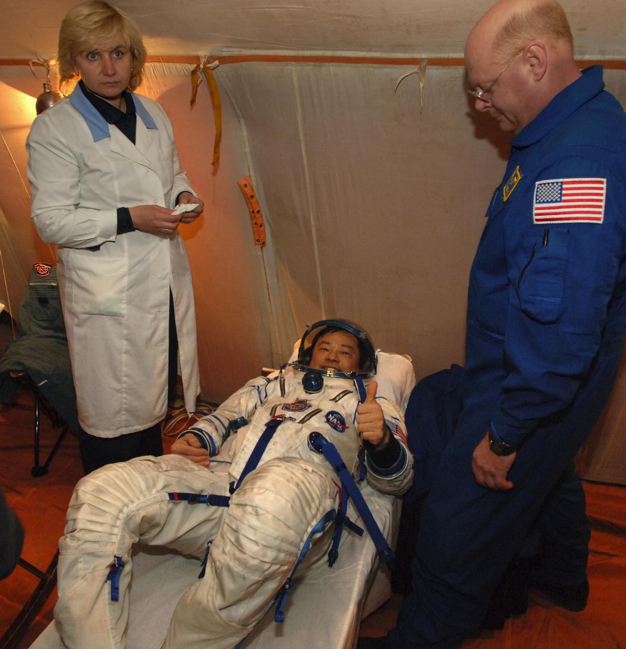 Expedition 10 Commander Leroy Chiao rests in an inflatable medical tent after pre-dawn landing in the Soyuz TMA-5 capsule Monday, April 25, 2005 northeast of the town of Arkalyk, Kazakhstan. Chiao and Expedition 10 Flight Engineer Salizhan Sharipov wrapped up a six-month mission aboard the International Space Station. European Space Agency astronaut Roberto Vittori completed a ten-day mission aboard the ISS under a commercial contract between ESA and the Russian Federal Space Agency. Photo Credit: (NASA/Bill Ingalls)