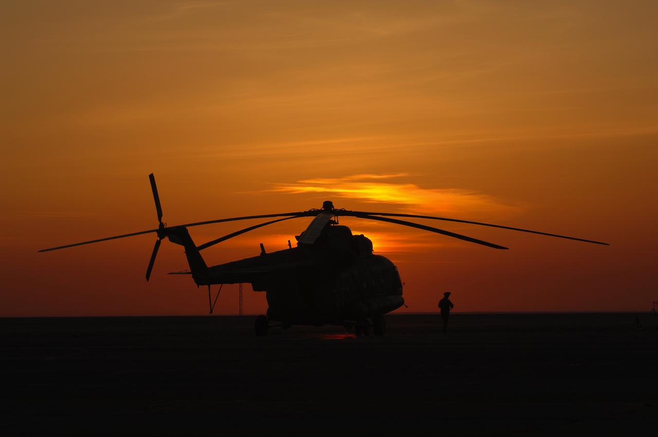 A Russian search and rescue helicopter waits to take a member of the Expedition 10 crew to Kustanay, Kazakshtan from Arkalyk, Monday, April, 25, 2005. Expedition 10 Commander Leroy Chiao, Flight Engineer Salizhan Sharipov and European Space Agency astronaut Roberto Vittori brought their Soyuz TMA-5 capsule to a pre-dawn landing April 25 northeast of the town of Arkalyk to wrap up a six-month mission aboard the International Space Station for Chiao and Sharipov, and a ten-day mission for Vittori, who flew under a commercial contract between ESA and the Russian Federal Space Agency. Photo Credit: (NASA/Bill Ingalls)