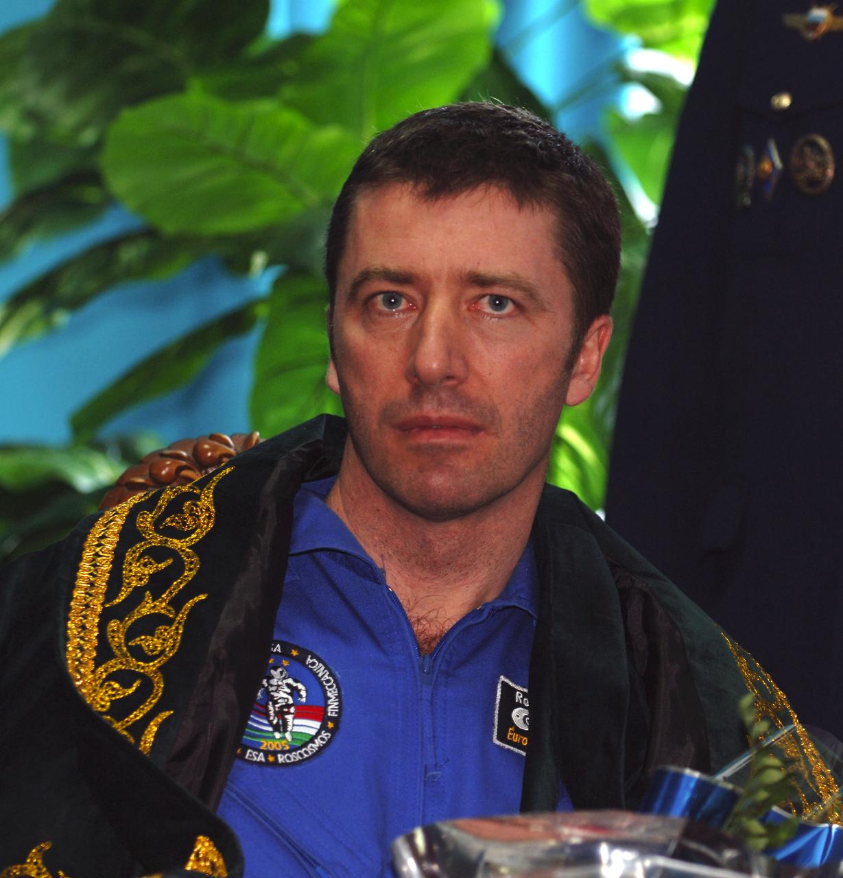 European Space Agency astronaut Roberto Vittori receives flowers upon arrival in Kustanay, Kazakhstan, Monday, April 25, 2005.  Vittori, Expedition 10 Commander Leroy Chiao and Flight Engineer Salizhan Sharipov brought their Soyuz TMA-5 capsule to a pre-dawn landing April 25 northeast of the town of Arkalyk to wrap up a six-month mission aboard the International Space Station for Chiao and Sharipov, and a ten-day mission for Vittori, who flew under a commercial contract between ESA and the Russian Federal Space Agency.  Photo Credit: (NASA/Bill Ingalls)
