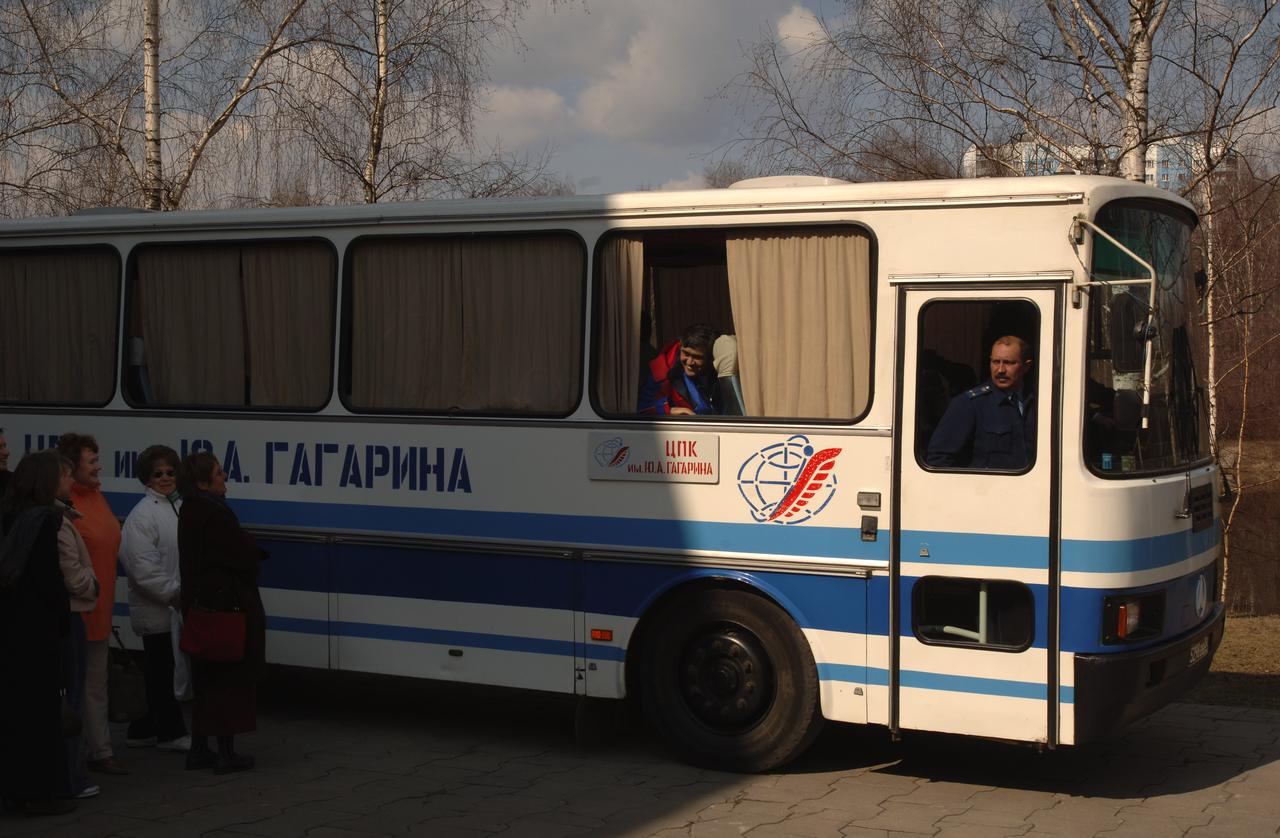 Expedition 10 Flight Engineer Salizhan Sharipov, on bus, looks out at well wishers after arriving back at Star City, Russia from Kazakhstan, Monday, April 25, 2005.  Expedition 10 Commander Leroy Chiao, Flight Engineer Salizhan Sharipov and European Space Agency astronaut Roberto Vittori brought their Soyuz TMA-5 capsule to a pre-dawn landing April 25 northeast of the town of Arkalyk to wrap up a six-month mission aboard the International Space Station for Chiao and Sharipov, and a ten-day mission for Vittori, who flew under a commercial contract between ESA and the Russian Federal Space Agency.  Photo Credit: (NASA/Bill Ingalls)
