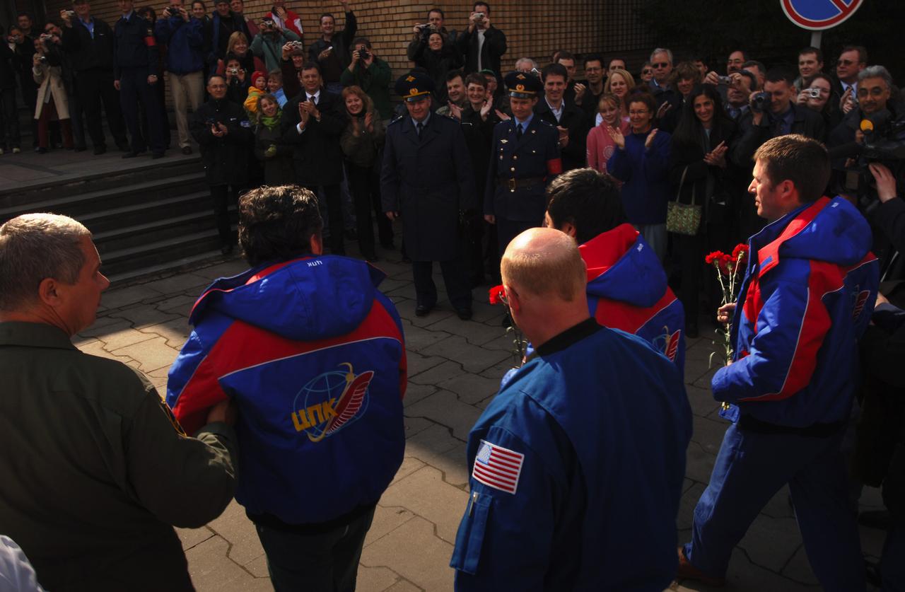 European Space Agency astronaut Roberto Vittori, right, Expedition 10 Commander Leroy Chiao and Expedition 10 Flight Engineer Salizhan Sharipov, second from left, are welcomed home by well wishers at Star City, Russia, Monday, April 25, 2005.  The crew brought their Soyuz TMA-5 capsule to a pre-dawn landing April 25 northeast of the town of Arkalyk in Kazakhstan to wrap up a six-month mission aboard the International Space Station for Chiao and Sharipov, and a ten-day mission for Vittori, who flew under a commercial contract between ESA and the Russian Federal Space Agency.  Photo Credit: (NASA/Bill Ingalls)
