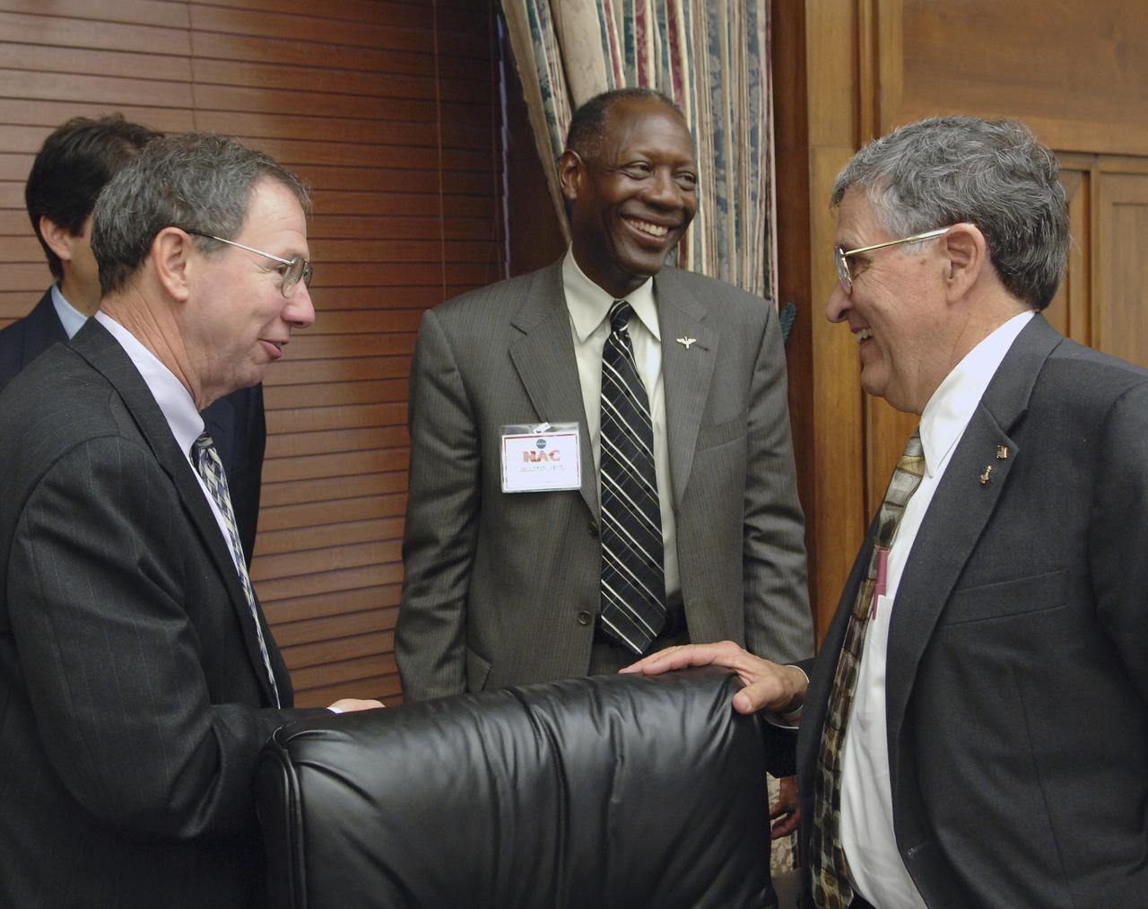 NASA Administrator Michael Griffin, left, talks with NASA Advisory Council members Gen. Lester L. Lyles, USAF (Ret.), center, and NASA Advisory Council chairman, former Senator and Apollo astronaut Harrison H. "Jack" Schmitt at the Rayburn House Office Building, Tuesday, Nov. 29, 2005, in Washington.  Photo Credit: (NASA/Bill Ingalls)
