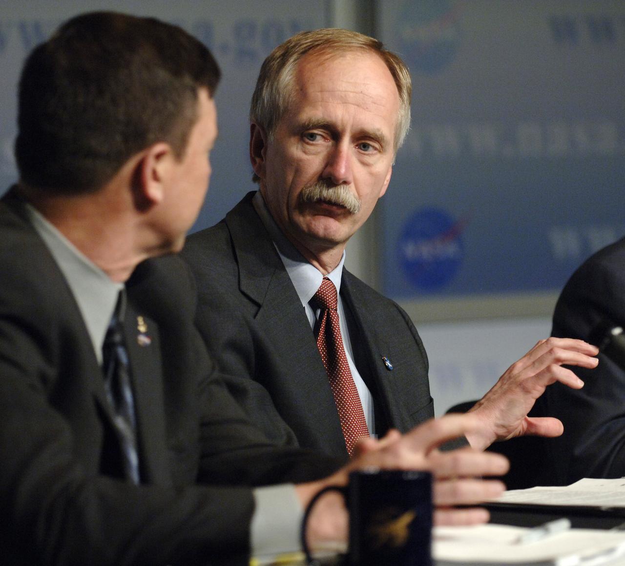NASA Associate Administrator for Space Operations William Gerstenmaier, right, and NASA Associate Administrator for Exploration Systems Scott J. Horowitz talk during the fiscal year 2007 news conference, Monday, Feb. 6, 2006, at NASA Headquarters in Washington. NASA Administrator Michael Griffin was joined by the heads of NASA's four mission directorates to explain how the proposed $16.8 billion dollar budget supports the Vision for Space Exploration. The budget represents a 3.2% increase above the fiscal year 2006 appropriated budget. Photo Credit: (NASA/Bill Ingalls)