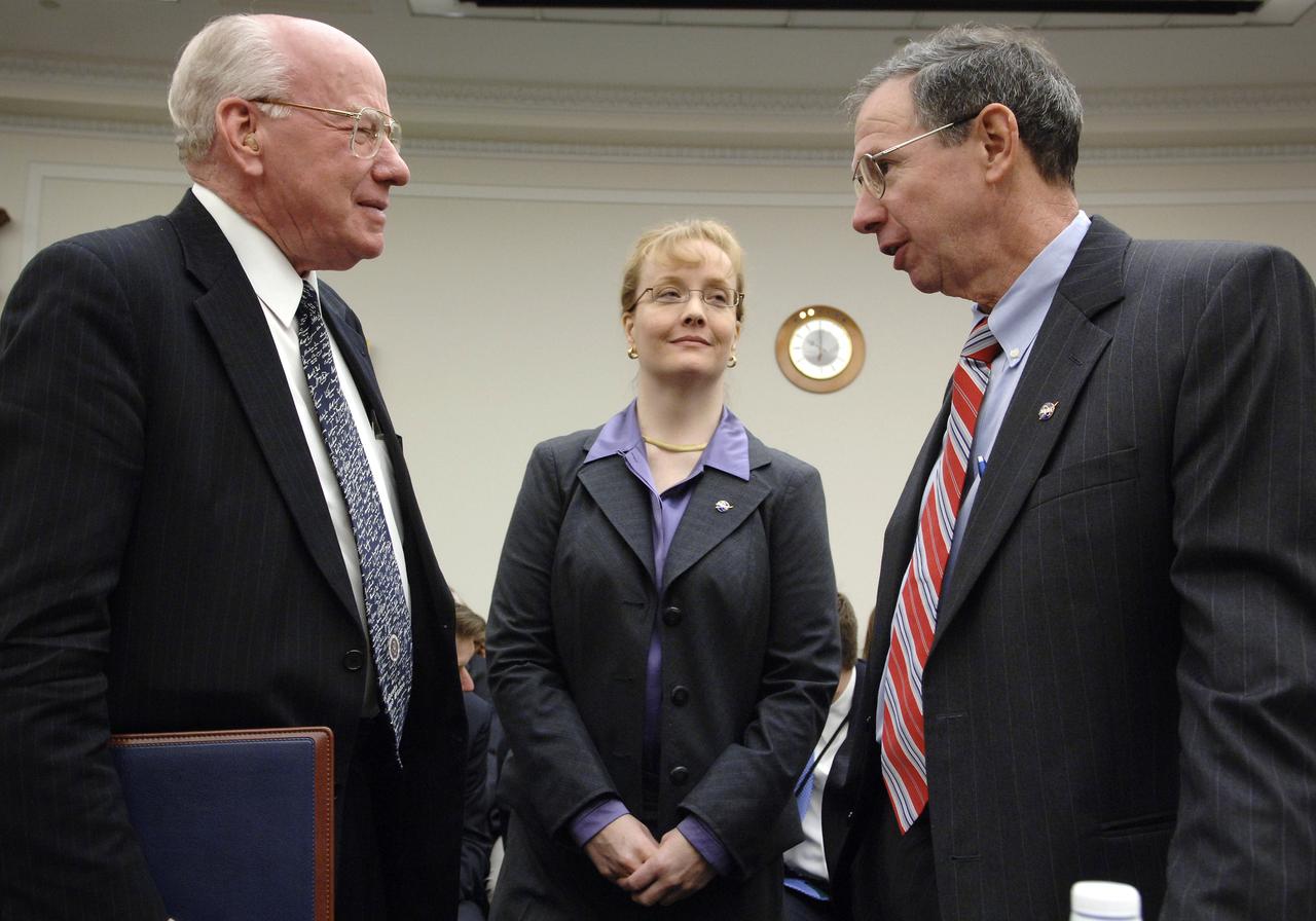 U.S. Rep. Vernon J. Ehlers , R-Mich., left, talks with NASA Administrator Michael Griffin, right, as NASA Deputy Administrator Shana Dale looks on prior to the start of a hearing before the House Science & Technology Committee  regarding NASA's FY 2007 budget request, Thursday, Feb., 16, 2006, in Washington. Photo Credit: (NASA/Bill Ingalls)