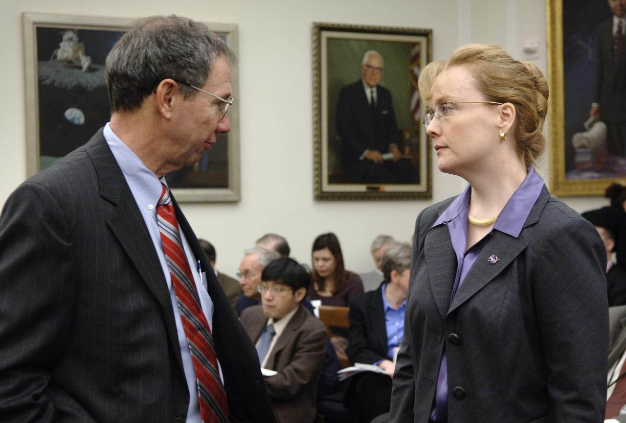 NASA Administrator Michael Griffin, left, and NASA Deputy Administrator Shana Dale talk prior to the start of a hearing before the House Science & Technology Committee  regarding NASA's FY 2007 budget request, Thursday, Feb., 16, 2006, in Washington. Photo Credit: (NASA/Bill Ingalls)