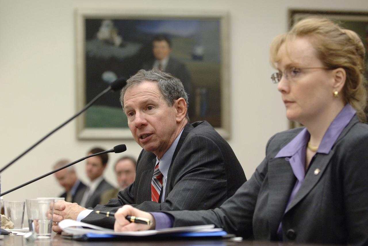 NASA Administrator Michael Griffin testifies as NASA Deputy Administrator Shana Dale looks on during a hearing before the House Science & Technology Committee regarding NASA's FY 2007 budget request, Thursday, Feb., 16, 2006, in Washington. Photo Credit: (NASA/Bill Ingalls)